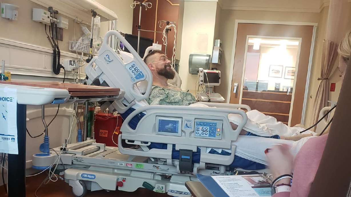 Luke Grover lays in his hospital bed in the Huntsman Cancer Institute on Jan. 19. Getting a cancer diagnosis and treatment can feel like an emotional roller coaster and living in limbo, Grover says.