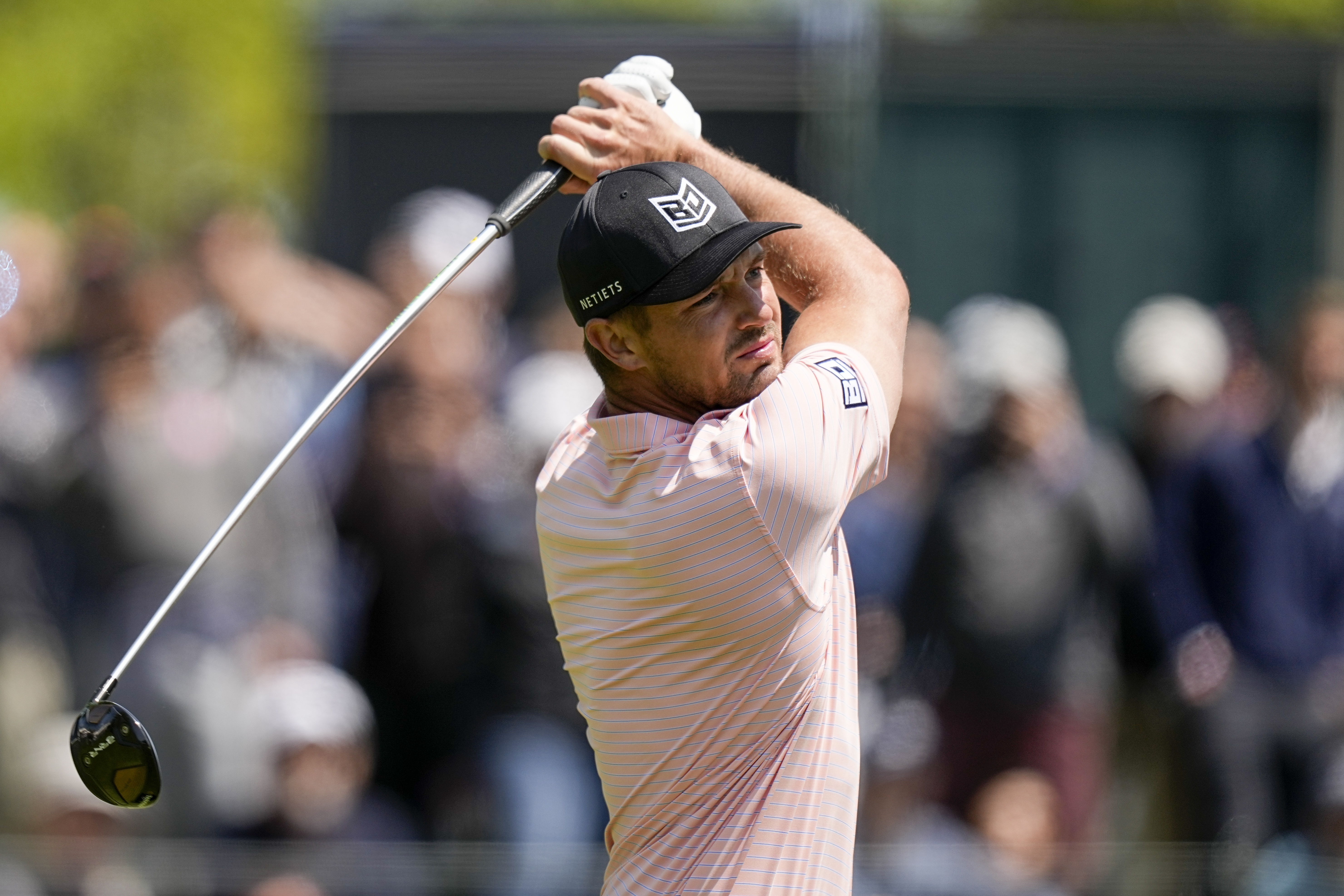 Bryson DeChambeau watches his tee shot on the 14th hole during the first round of the PGA Championship golf tournament at Oak Hill Country Club on Thursday, May 18, 2023, in Pittsford, N.Y. 
