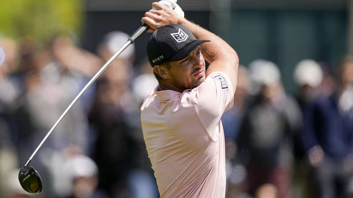 Bryson DeChambeau watches his tee shot on the 14th hole during the first round of the PGA Championship golf tournament at Oak Hill Country Club on Thursday, May 18, 2023, in Pittsford, N.Y.