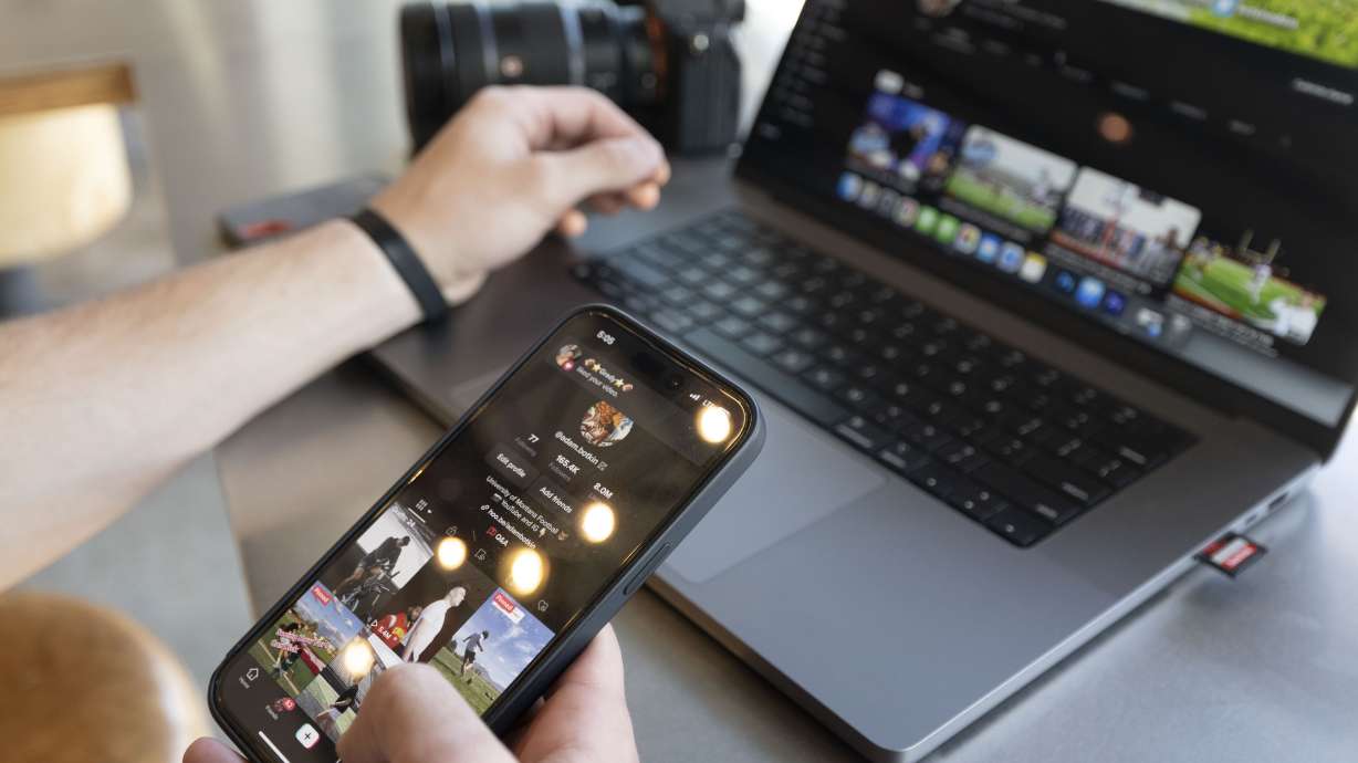 Adam Botkin, a football TikTok influencer, edits a video at a Chipotle Mexican Grill in Missoula, Mont., on May 3. Five TikTok content creators have filed a lawsuit to overturn a planned ban on the video-sharing app in Montana.