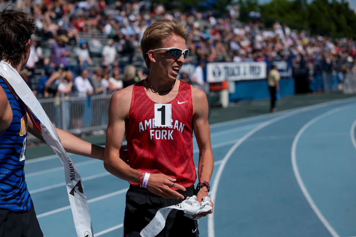 Daniel Simmons of American Fork celebrates after taking first in the 6A boys 3,200-meter finals at the Utah high school track and field championships at BYU in Provo on Thursday, May 18, 2023.