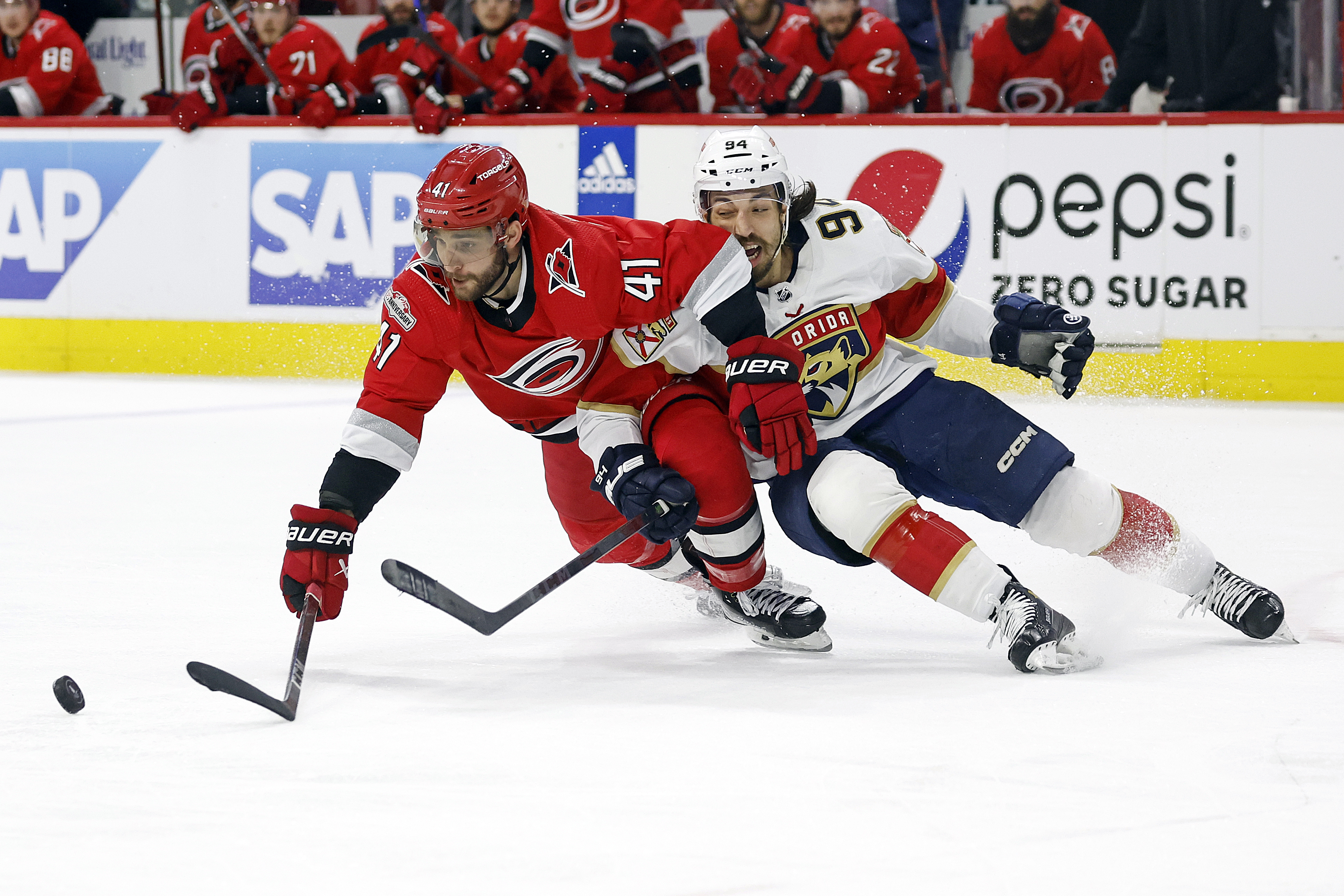 Carolina Hurricanes' Shayne Gostisbehere (41) tangles with Florida Panthers' Ryan Lomberg (94) during the third period of Game 1 of the NHL hockey Stanley Cup Eastern Conference finals in Raleigh, N.C., Thursday, May 18, 2023.
