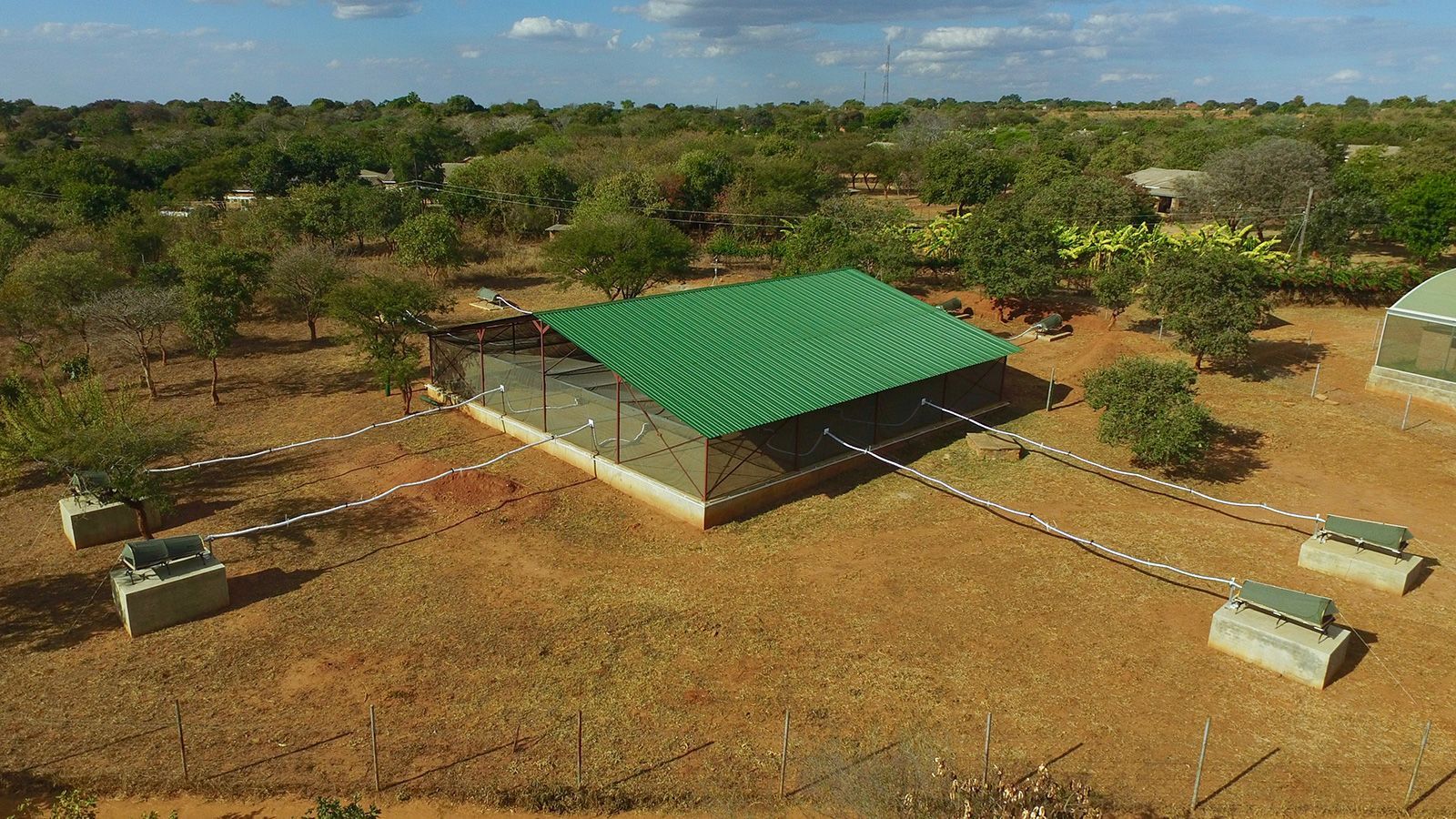 Researchers set up a screened facility the size of a skating rink to help understand how mosquitoes that transmit malaria find humans.