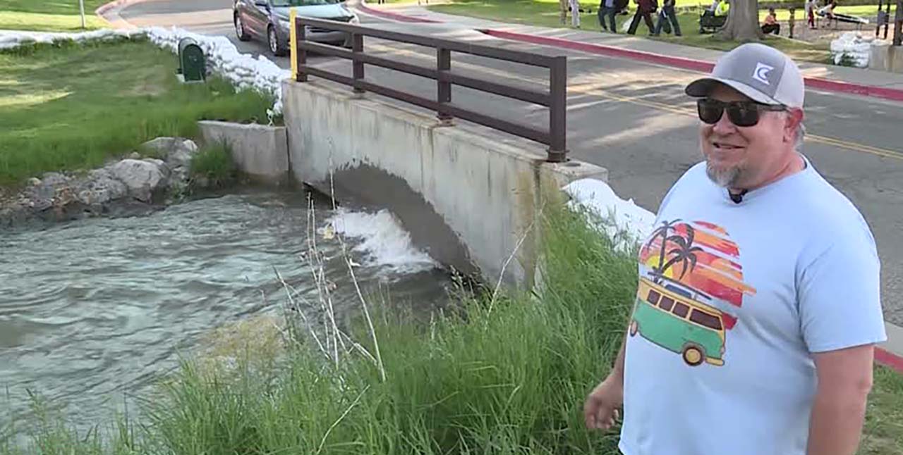 Eric Gerrard talks to KSL Thursday at Murray City Park in Murray, where Little Cottonwood Creek is rising.