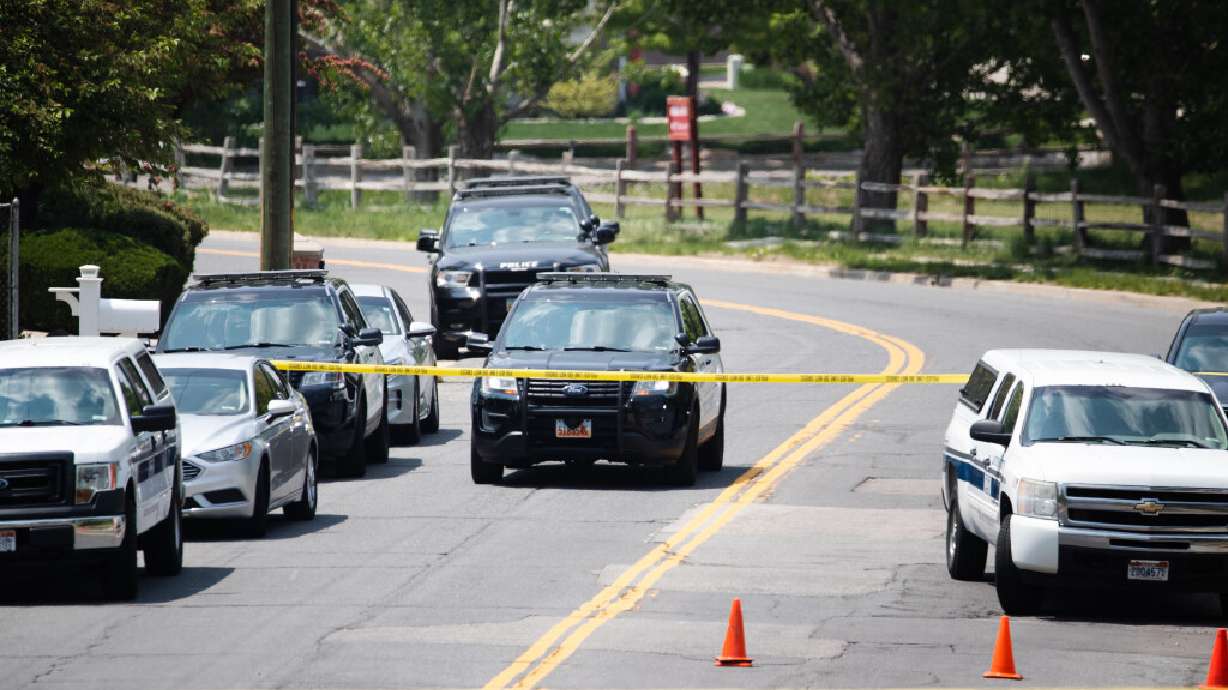 Layton police cars wait outside the scene of a triple homicide in Layton on May 19. Jeremy Lake Bailey, 34, has pleaded guilty to three counts of aggravated murder, a first-degree felony, after police say he shot and killed his wife and in-laws.