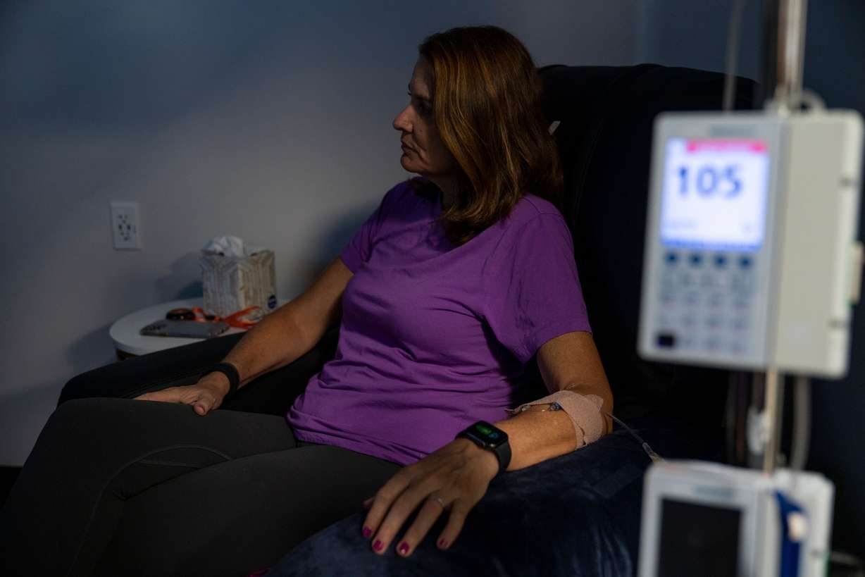 Michele Hall, 55, receives her eighth Aduhelm treatment/infusion at a local clinic in St. Petersburg, Fla., on Aug. 3, 2022. Hall was diagnosed with early onset Alzheimer’s disease in fall 2020.
