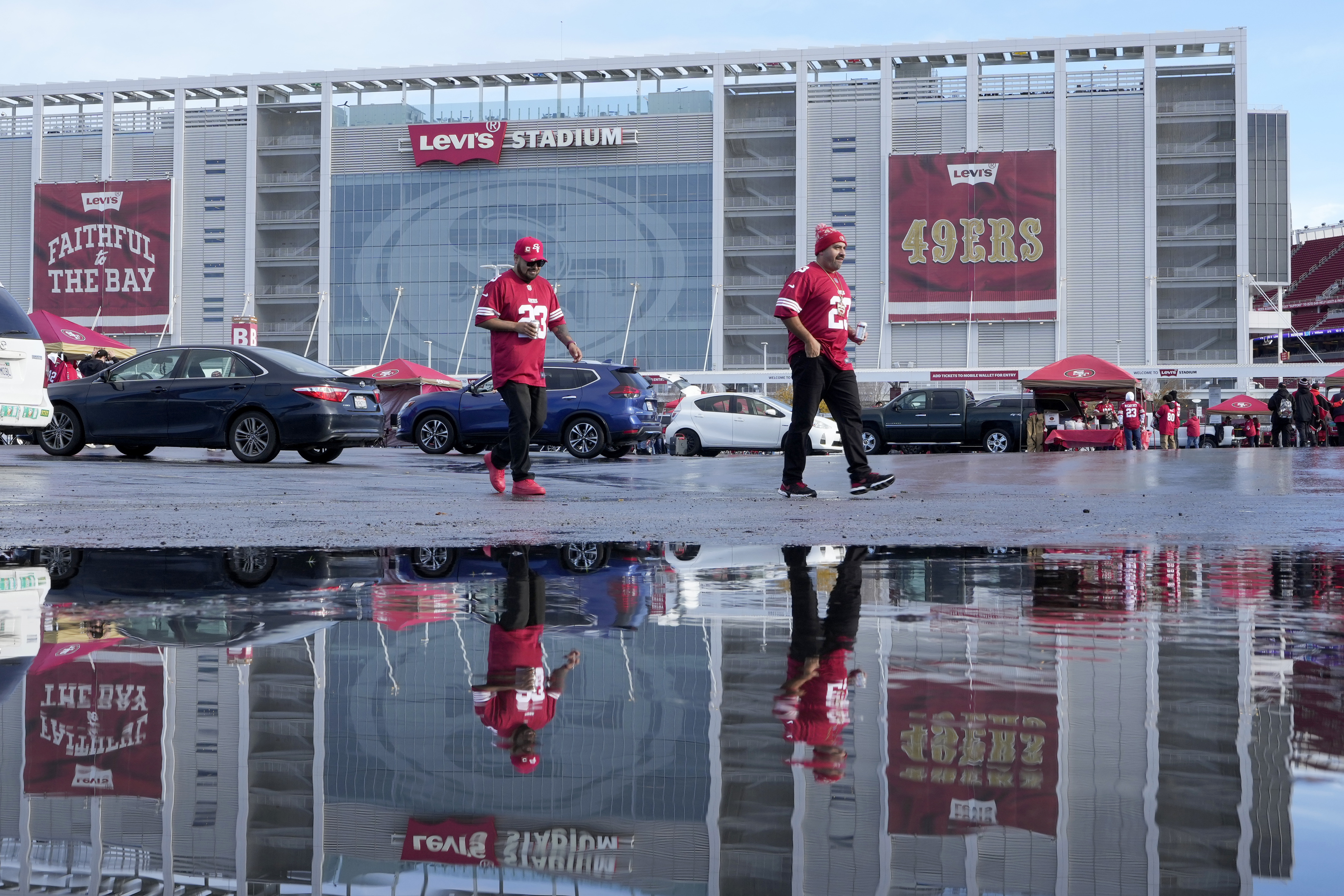 FILE - Fans walk outside Levi's Stadium before an NFL football game between the San Francisco 49ers and the Tampa Bay Buccaneers in Santa Clara, Calif., on Dec. 11, 2022. The former chief lobbyist for the 49ers has testified that a Silicon Valley city councilman illegally leaked a confidential report criticizing the team's political influence, according to the San Francisco Chronicle, Friday, May 19, 2023.
