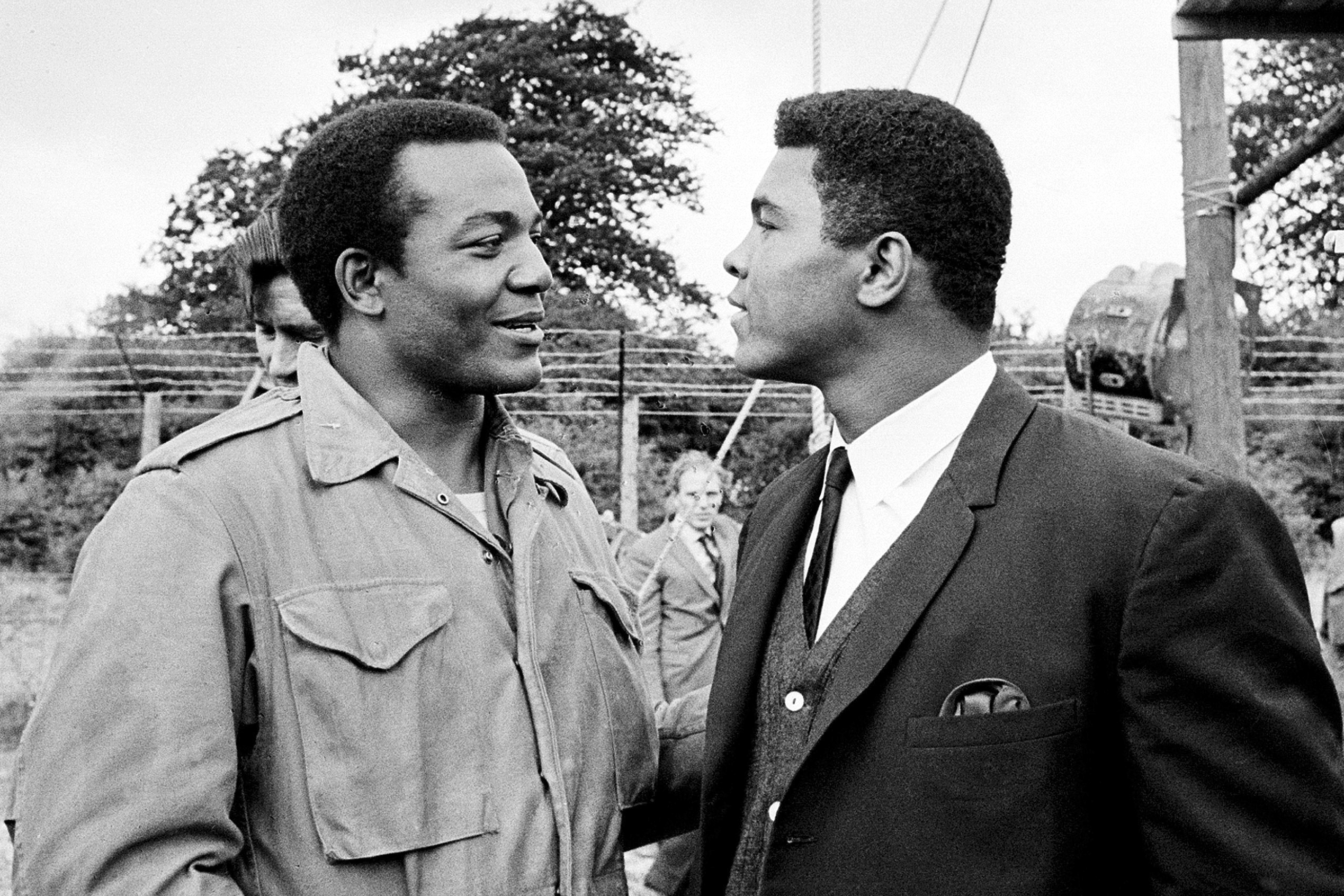 FILE - In this Aug. 5, 1966, file photo, heavyweight boxer Muhammad Ali, right, visits Cleveland Browns running back and actor Jim Brown on the film set of "The Dirty Dozen" at Morkyate, Bedfordshire, England. NFL legend, actor and social activist Jim Brown passed away peacefully in his Los Angeles home on Thursday night, May 18, 2023, with his wife, Monique, by his side, according to a spokeswoman for Brown's family. He was 87. 