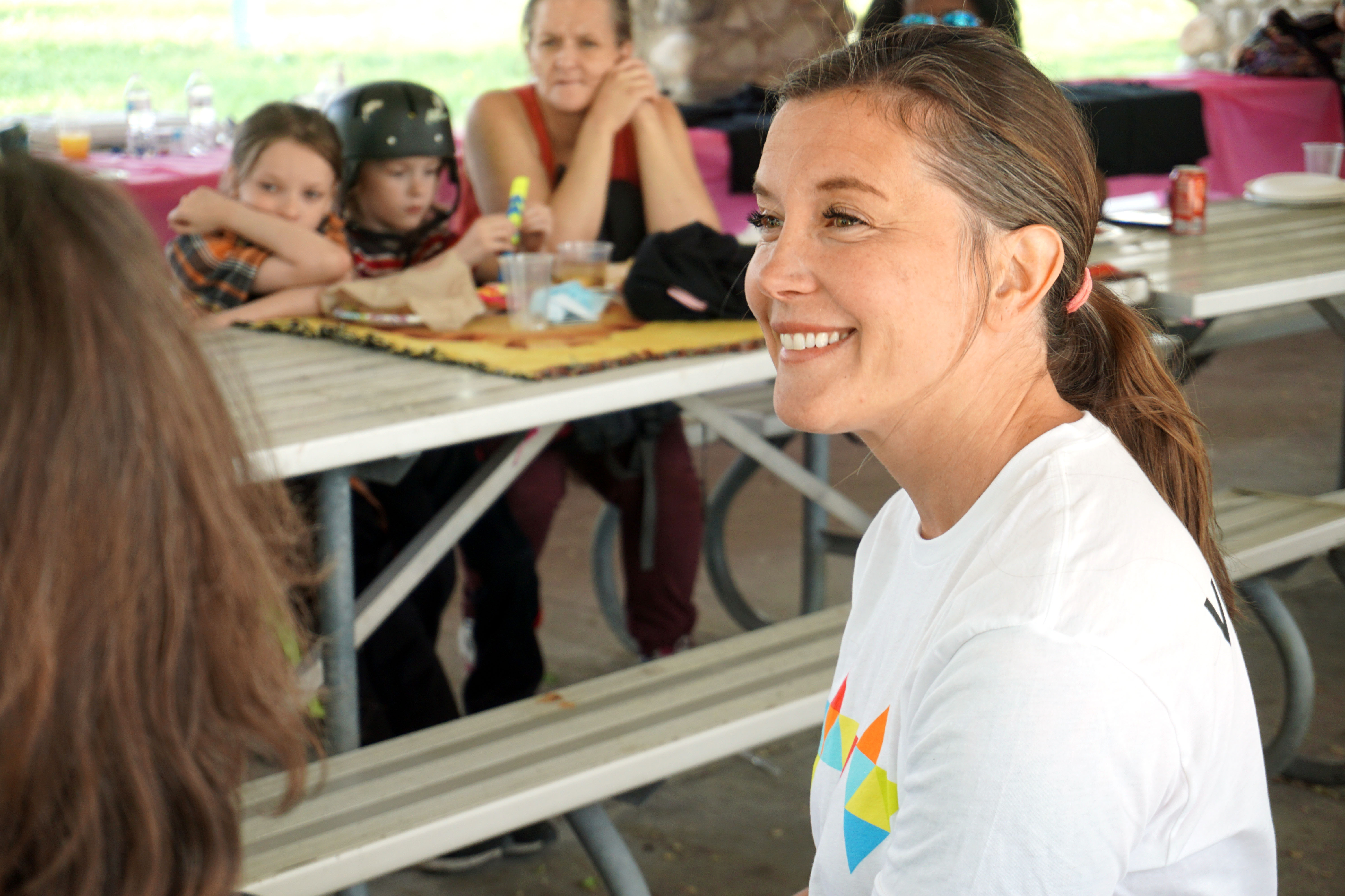 Salt Lake City Mayor Erin Mendenhall meets with low-income mothers, who are currently homeless or have experienced homelessness, at Jordan Park on Saturday. 