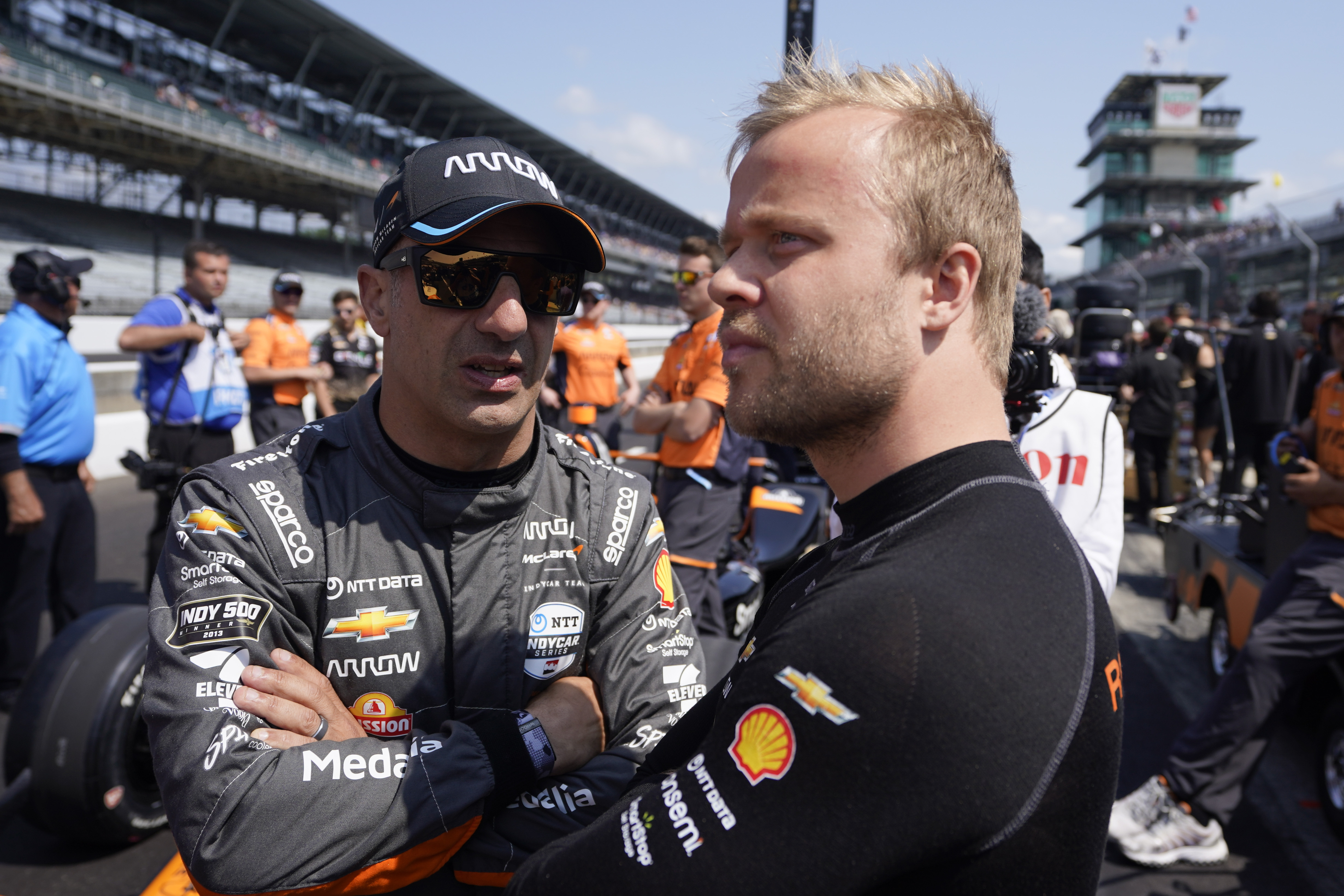 Tony Kanaan, left, of Brazil, talks with Felix Rosenqvist, of Sweden, during qualifications for the Indianapolis 500 auto race at Indianapolis Motor Speedway, Saturday, May 20, 2023, in Indianapolis. 