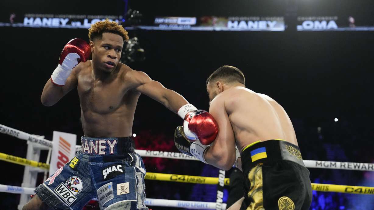 Devin Haney, left, fights Vasiliy Lomachenko in an undisputed lightweight championship boxing match Saturday, May 20, 2023, in Las Vegas.