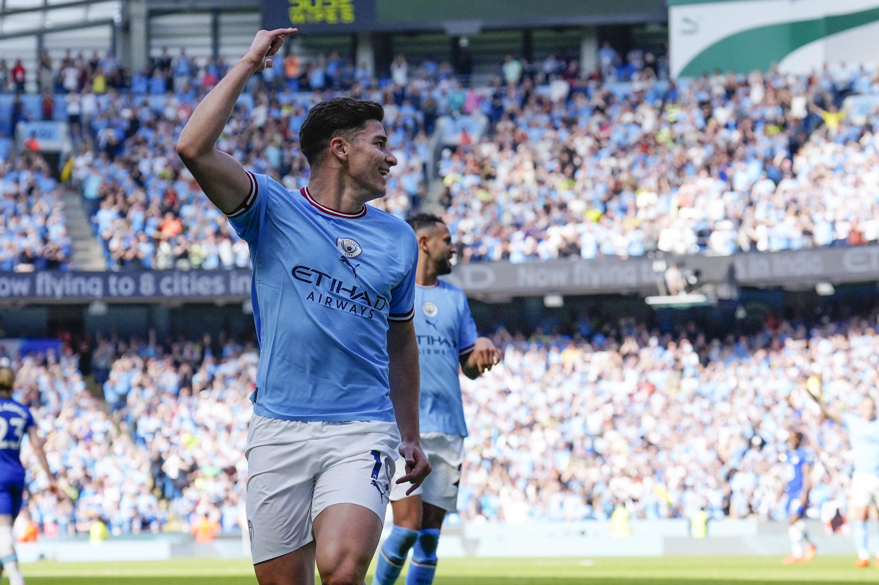 Manchester City's Julian Alvarez celebrates after scoring his side's opening goal during the English Premier League soccer match between Manchester City and Chelsea at the Etihad Stadium in Manchester, England, Sunday, May 21, 2023. 