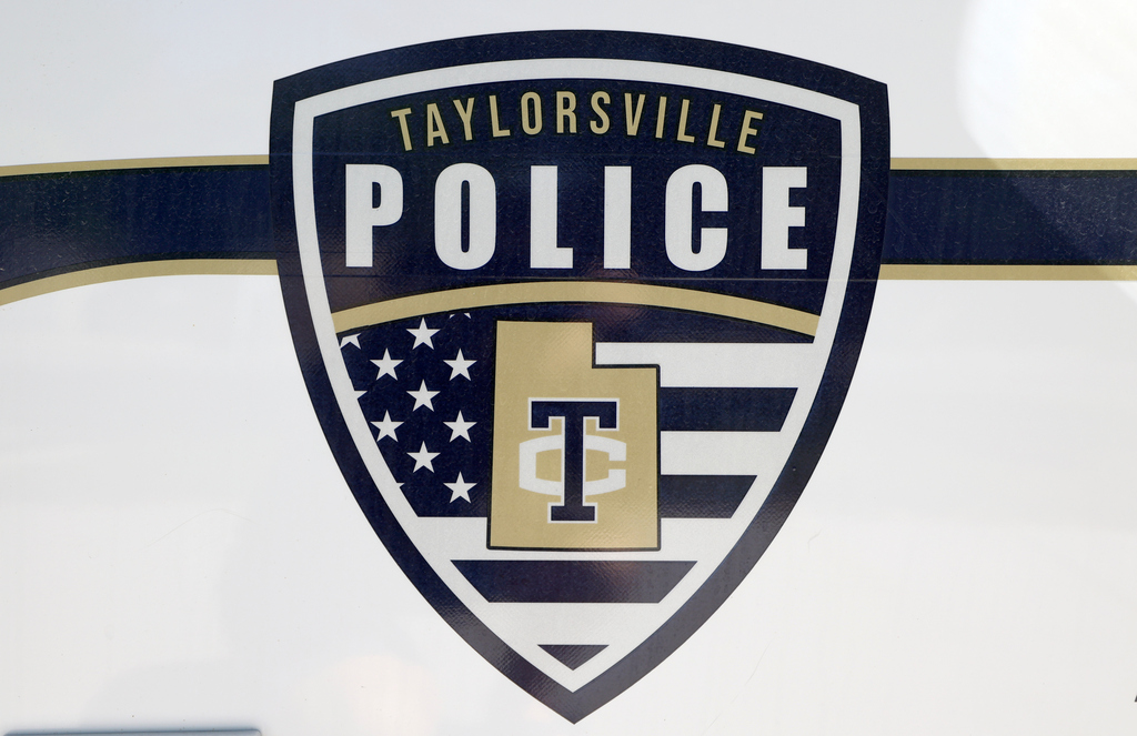 Police are investigating what lead to a woman's body being discovered in car at a field in Taylorsville.
