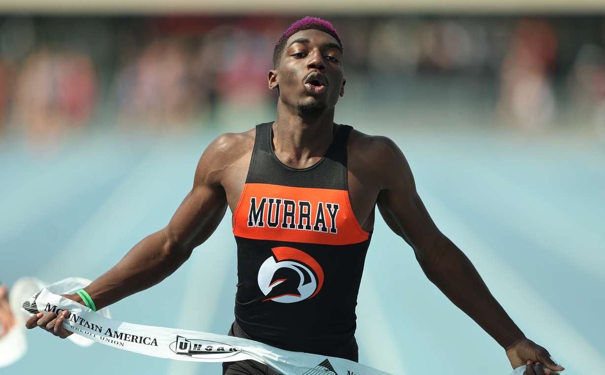 Weber State commit Amari Adams of Murray leans into the tape to win the state 100-meter title in 10.53 during the UHSAA 5A state track and field meet at BYU, Saturday, May 20, 2023.