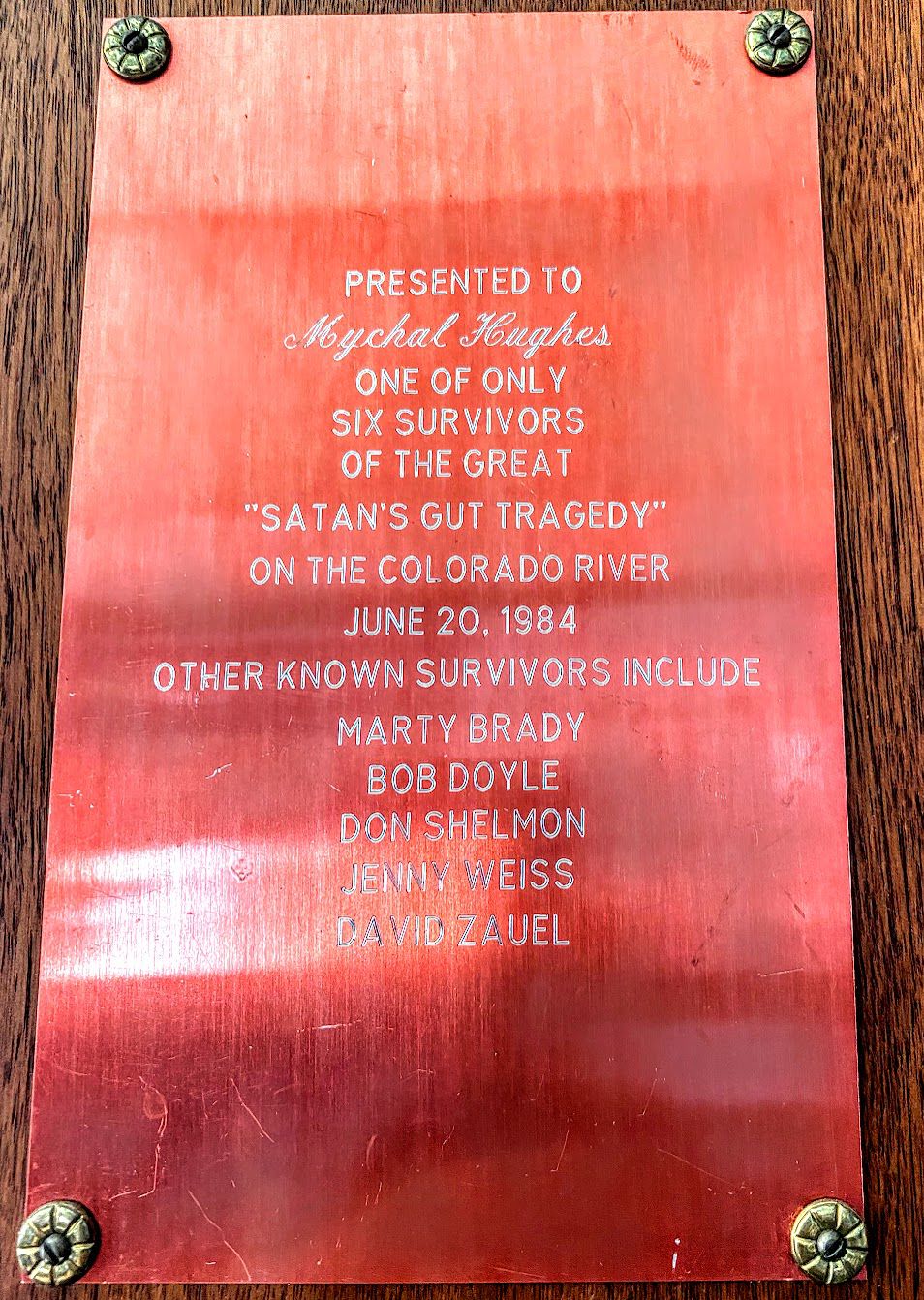 This plaque commemorating “the only time I ever flipped a boat” hangs on river runner Myke Hughes’ office wall, remembering the high water of 1984.