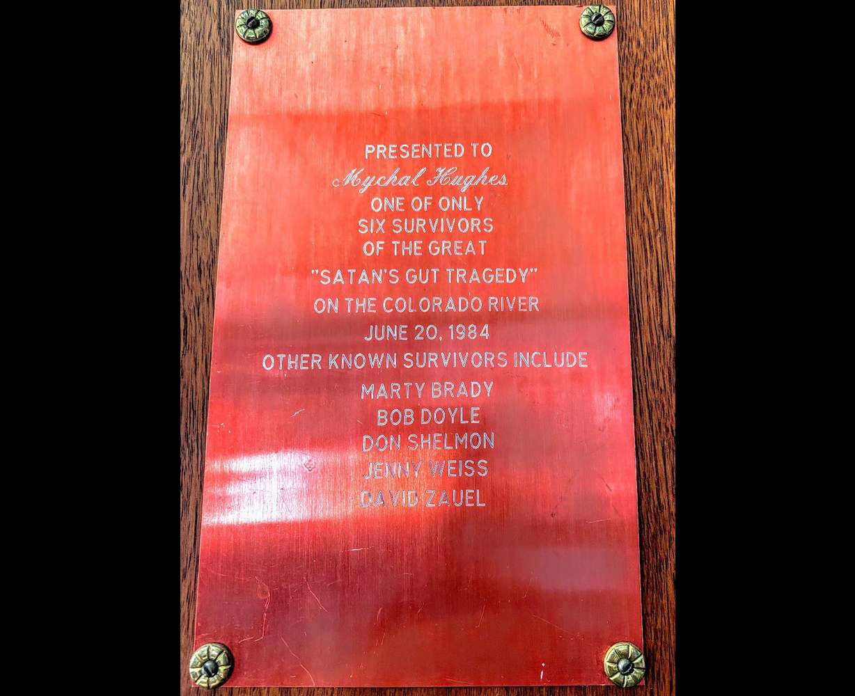 This plaque commemorating “the only time I ever flipped a boat” hangs on river runner Myke Hughes’ office wall, remembering the high water of 1984.