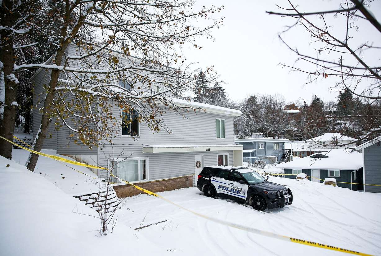 Police tape surrounds the residence where four University of Idaho students were killed as police monitor the scene on Nov. 30, 2022, in Moscow, Idaho.