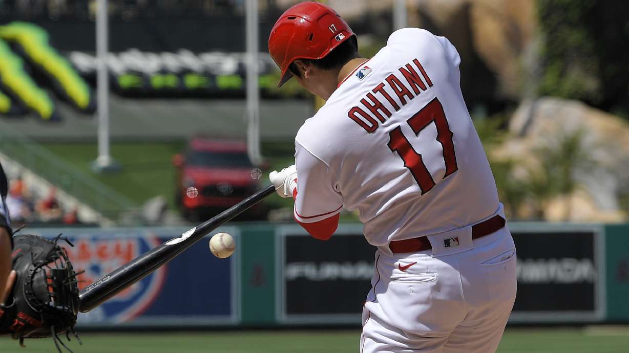 Los Angeles Angels' Shohei Ohtani hits into a fielder's choice during the seventh inning of a baseball game against the Minnesota Twins Sunday, May 21, 2023, in Anaheim, Calif. Mickey Moniak was thrown out at first on the play and Ohtani was safe at first.