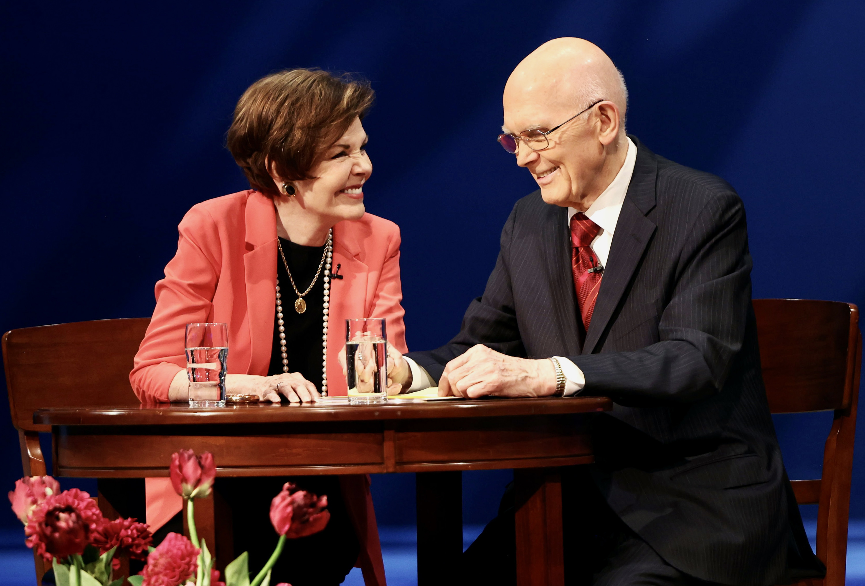 Sister Kristen Oaks, smiles over at her husband President Dallin H. Oaks as they speak to young adults of the church during a Worldwide Devotional from the Conference Center Theater in Salt Lake City on Sunday.