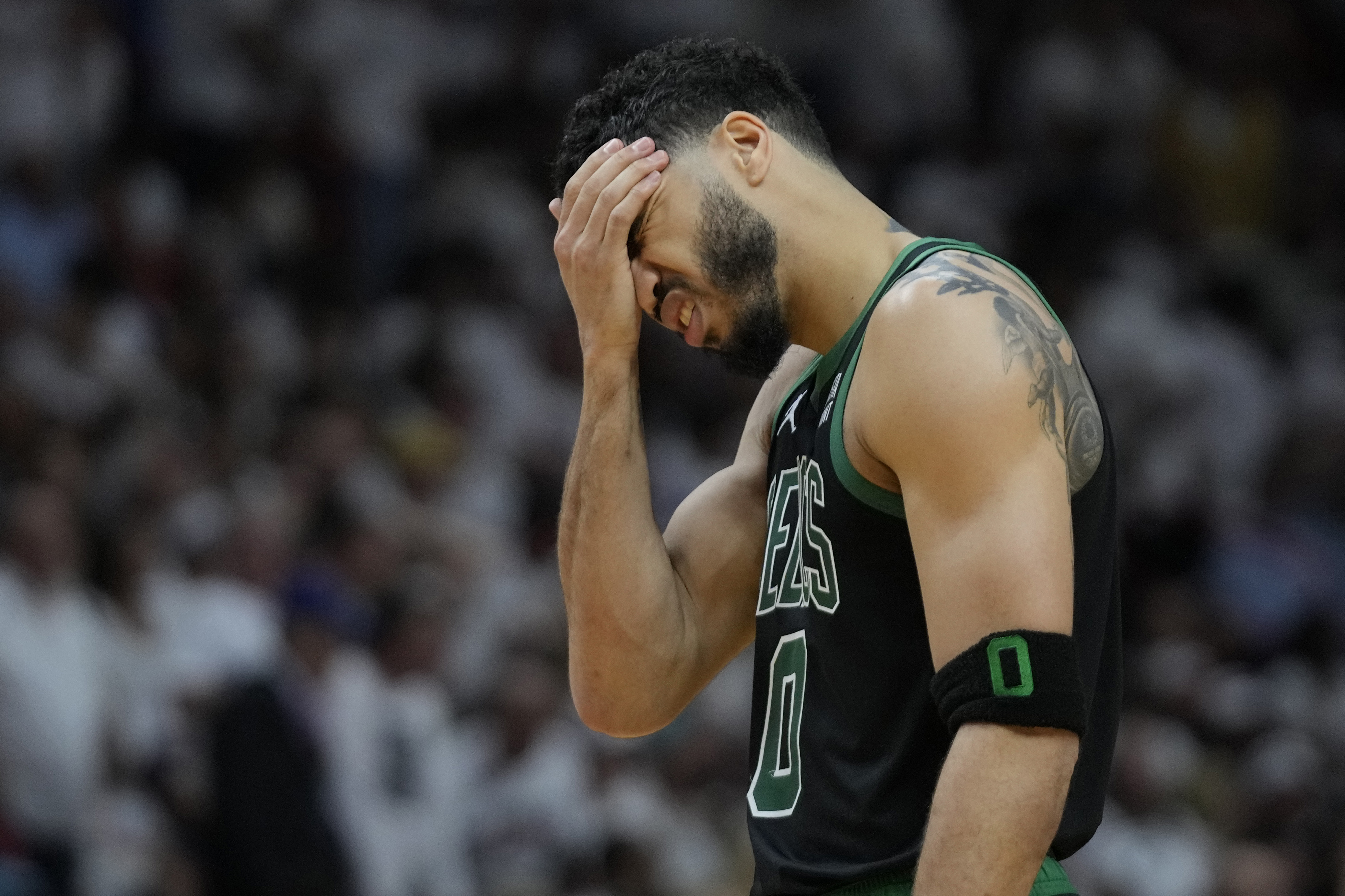 Boston Celtics forward Jayson Tatum (0) reacts during the second half of Game 3 of the NBA basketball playoffs Eastern Conference finals against the Miami Heat, Sunday, May 21, 2023, in Miami. 