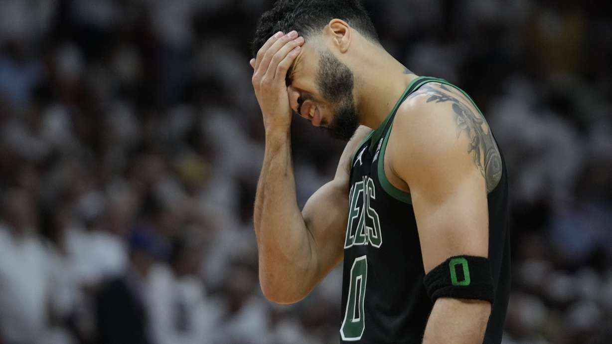 Boston Celtics forward Jayson Tatum (0) reacts during the second half of Game 3 of the NBA basketball playoffs Eastern Conference finals against the Miami Heat, Sunday, May 21, 2023, in Miami.