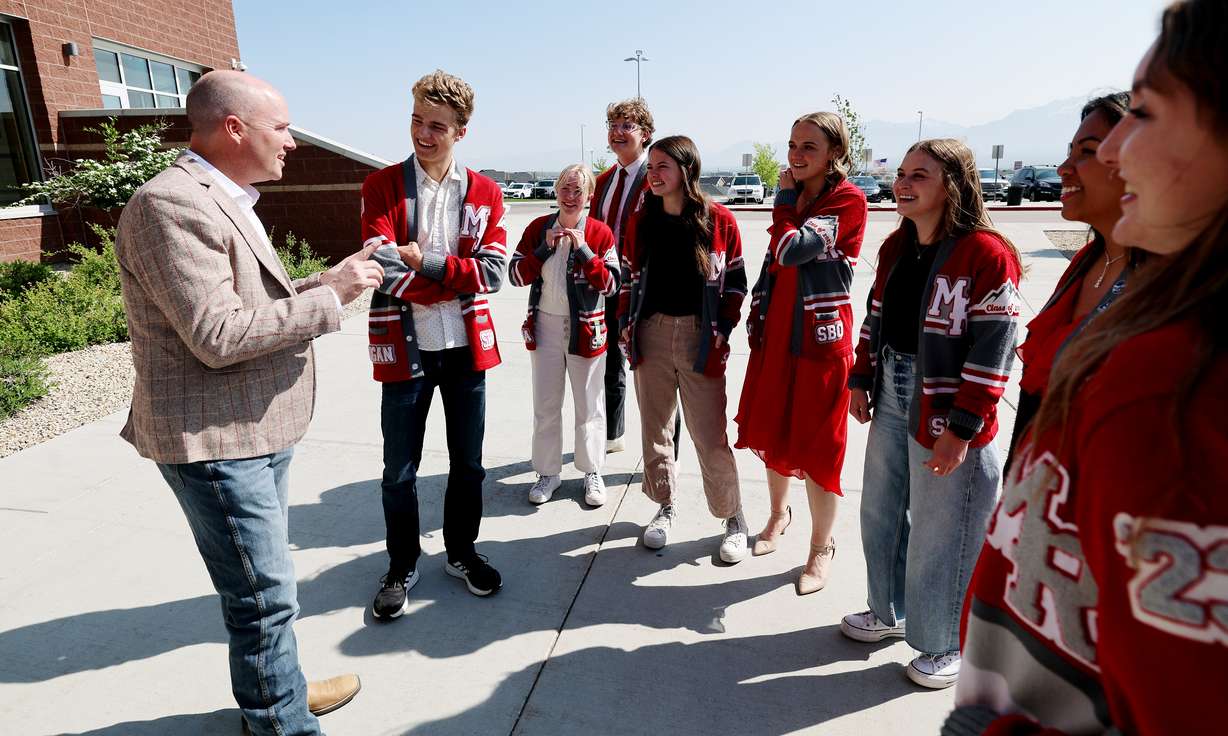 Gov. Spencer Cox talks with student body officers prior to him speaking to students at Mountain Ridge High School on Monday.