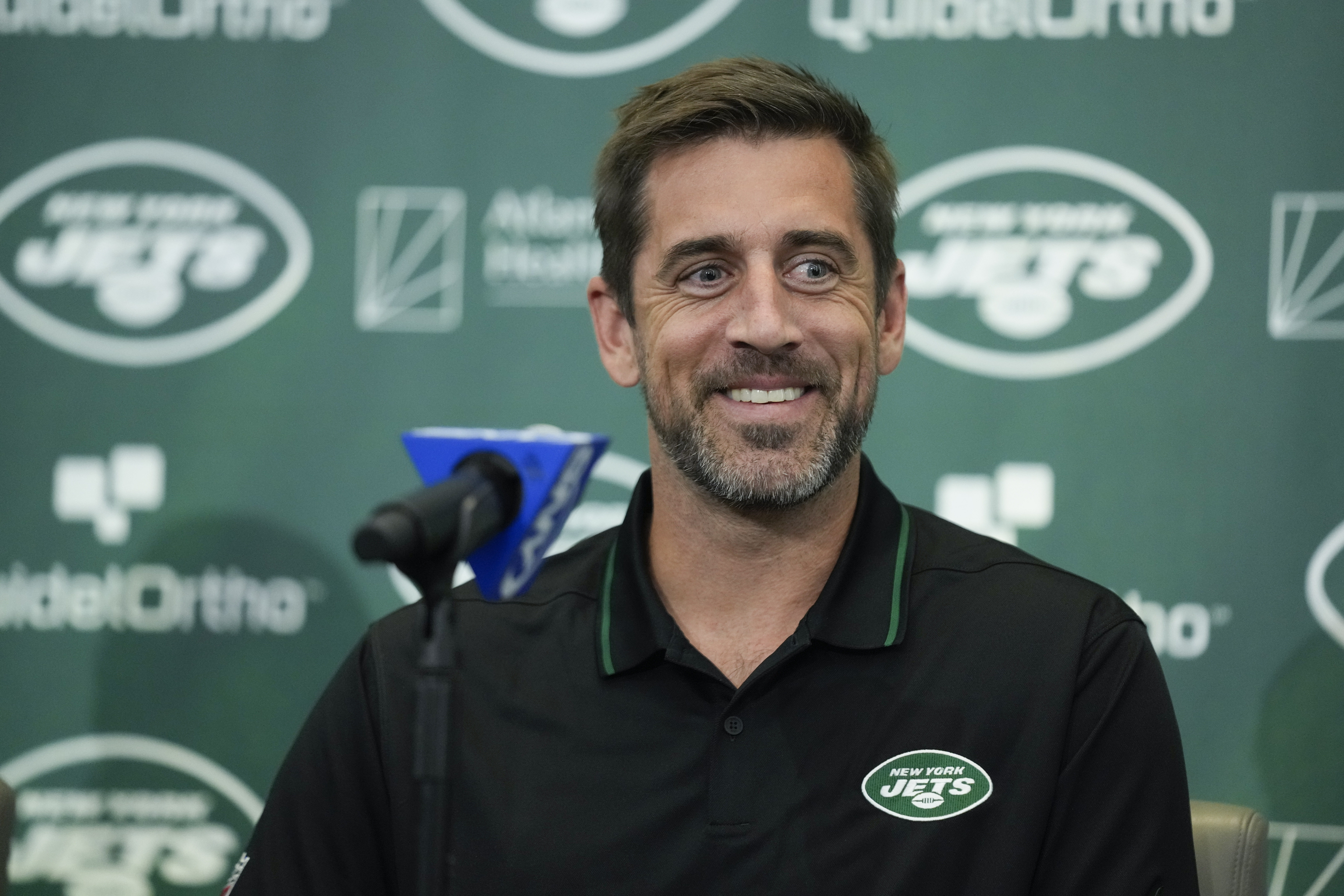FILE - New York Jets' quarterback Aaron Rodgers smiles during an NFL football news conference at the Jets' training facility in Florham Park, N.J., Wednesday, April 26, 2023. The Super Bowl champion Kansas City Chiefs will host the Detroit Lions on Sept. 7 to kick off the 2023 NFL season. And NFL fans will get their first look at star quarterback Aaron Rodgers in a Jets uniform when New York faces the Buffalo Bills on “Monday Night Football” on Sept. 11. That's according to early details released Thursday, May 11, 2023, on this year’s NFL schedule.
