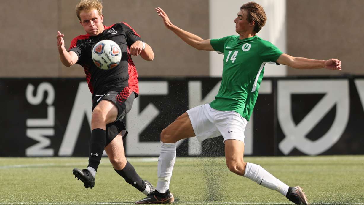 Alta’s Ryan Richards and Olympus’ Christian Kercher battle for the ball as they play in 5A semifinal soccer action at Zions Bank Stadium in Herriman on Monday, May 22, 2023.