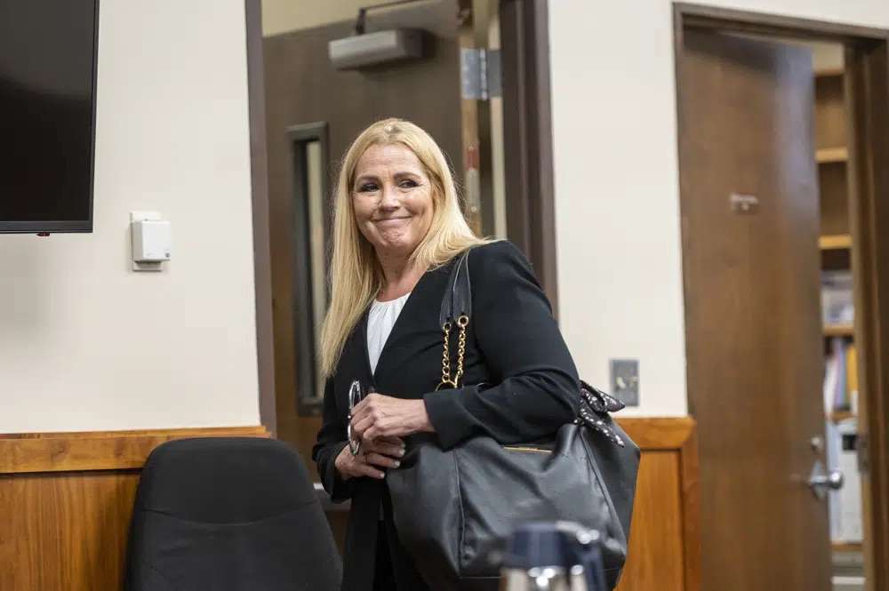 Public defender Anne Taylor enters a courtroom for Bryan Kohberger's arraignment hearing in Latah County District Court, Monday in Moscow, Idaho. Kohberger is accused of killing four University of Idaho students in November 2022.