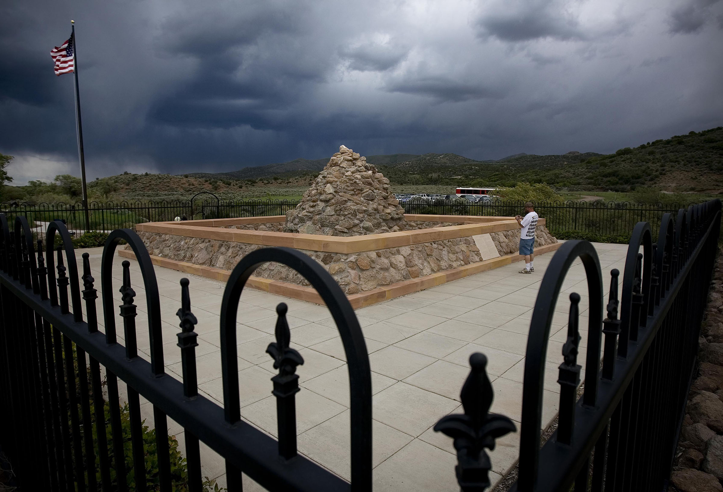 Curtis Davis walks the grounds of the Mountain Meadows Massacre monument Saturday during the 150th Commemoration of the Carleton Reburial.