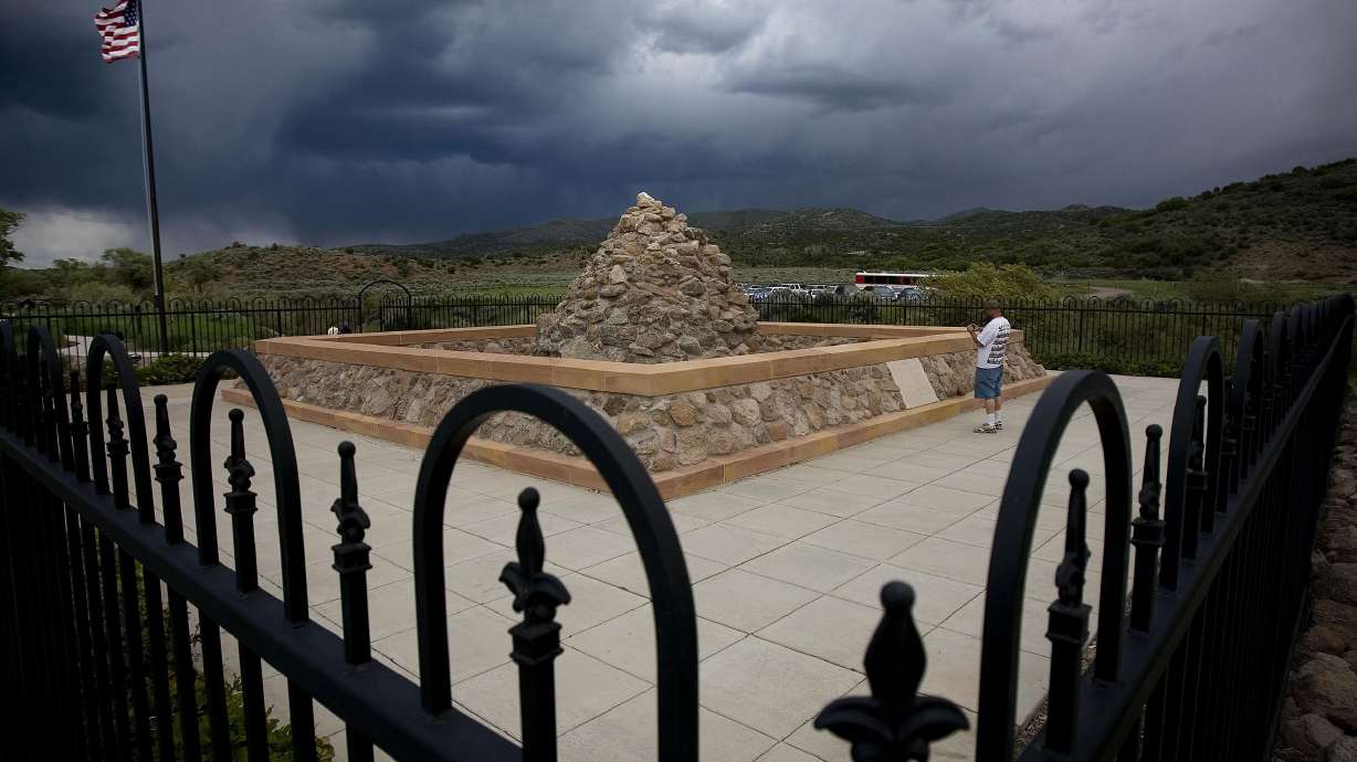 Curtis Davis walks the grounds of the Mountain Meadows Massacre monument Saturday during the 150th Commemoration of the Carleton Reburial.