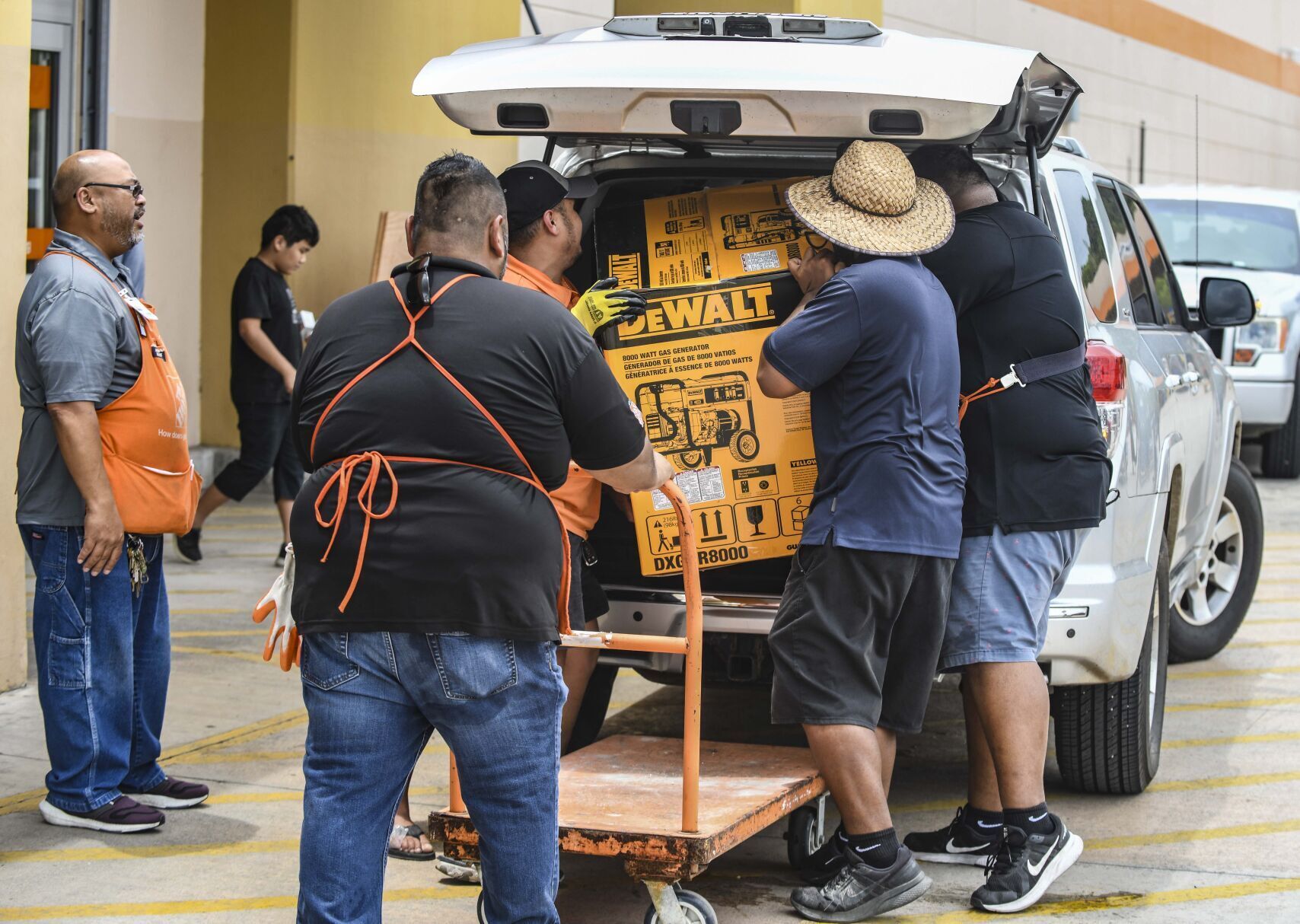 Residents prepare for Typhoon Mawar's approach Monday in Tamuning, Guam. Guam's governor is urging residents to stay home and is warning the island could take a direct hit from Typhoon Mawar.