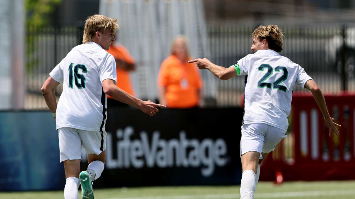 Syracuse’s Easton Cragun and Jack Cook point at each other after Gragun scored a goal against Lone Peak in 6A boys soccer state semifinal action at Zions Bank Stadium in Herriman on Tuesday, May 23, 2023. Syracuse won 4-1. The two players combined for four goals in the game.