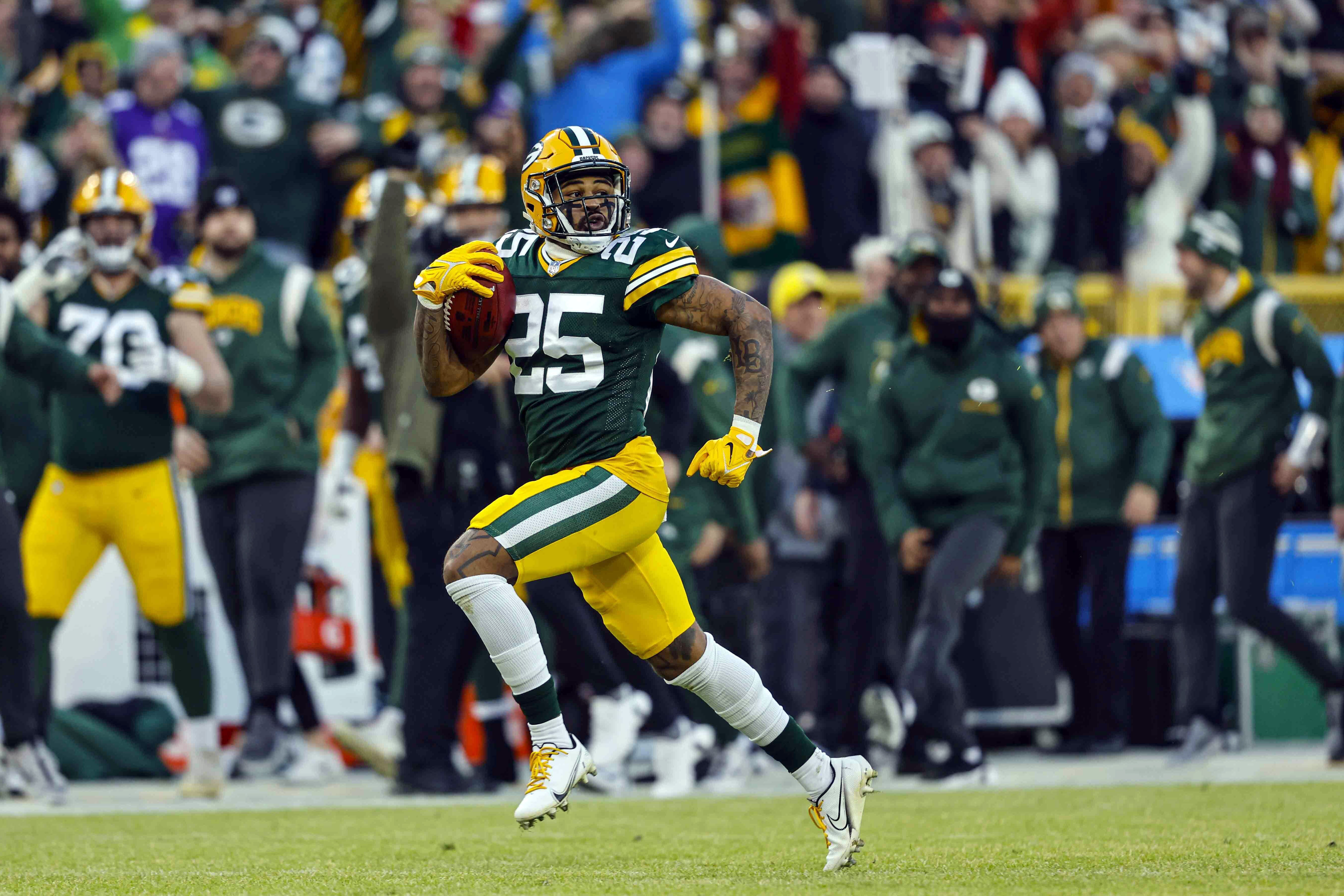 Green Bay Packers cornerback Keisean Nixon (25) runs back a kickoff for a touchdown during an NFL football game against the Minnesota Vikings Sunday, Jan. 1, 2023, in Green Bay, Wis. The NFL has pushed the kickoff return further toward irrelevance with a priority on player safety. League owners voted Tuesday, May 23, 2023, for a one-year trial of an enhanced touchback rule that will give the receiving team the ball at its own 25 with a fair catch of a kickoff anywhere behind that yard line. 
