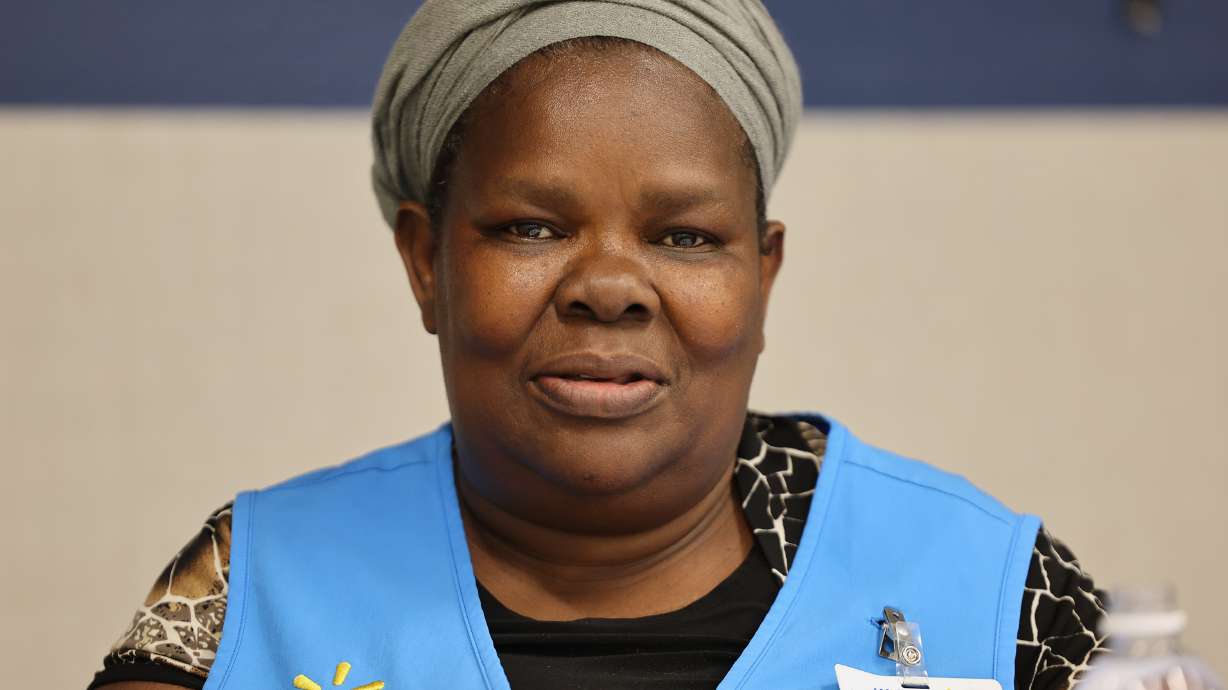 Olivia Sserabira, from Uganda, poses for a photo during her lunch break at Walmart in Salt Lake City on May 19. With her Walmart paycheck, she funds a nonprofit that is changing the lives of hundreds of women and girls in Uganda.