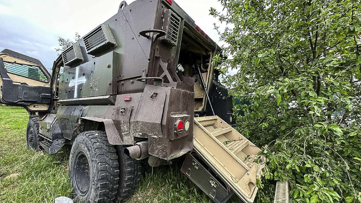 A damaged armored military vehicle is seen after fighting in Russia's western Belgorod region on Tuesday. The head of a Russian private army says his force lost more than 20,000 men in the battle for Bakhmut.