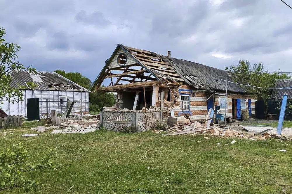 Damaged houses are seen in Russia's western Belgorod region on Tuesday. Russian troops and security forces fought for a second day Tuesday against an alleged cross-border raid that Moscow blamed on Ukrainian military saboteurs but which Kyiv portrayed as an uprising against the Kremlin by Russian partisans.