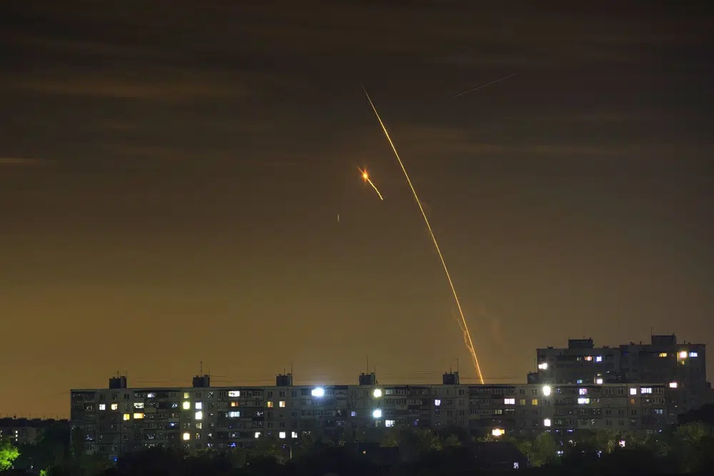 Russian rockets launch against Ukraine from Russia's Belgorod region are seen at dawn in Kharkiv, Ukraine, early May 14.