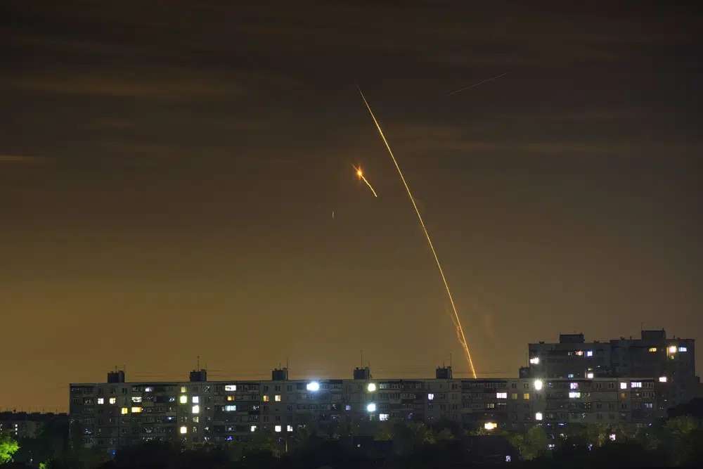 Russian rockets launch against Ukraine from Russia's Belgorod region are seen at dawn in Kharkiv, Ukraine, early May 14.