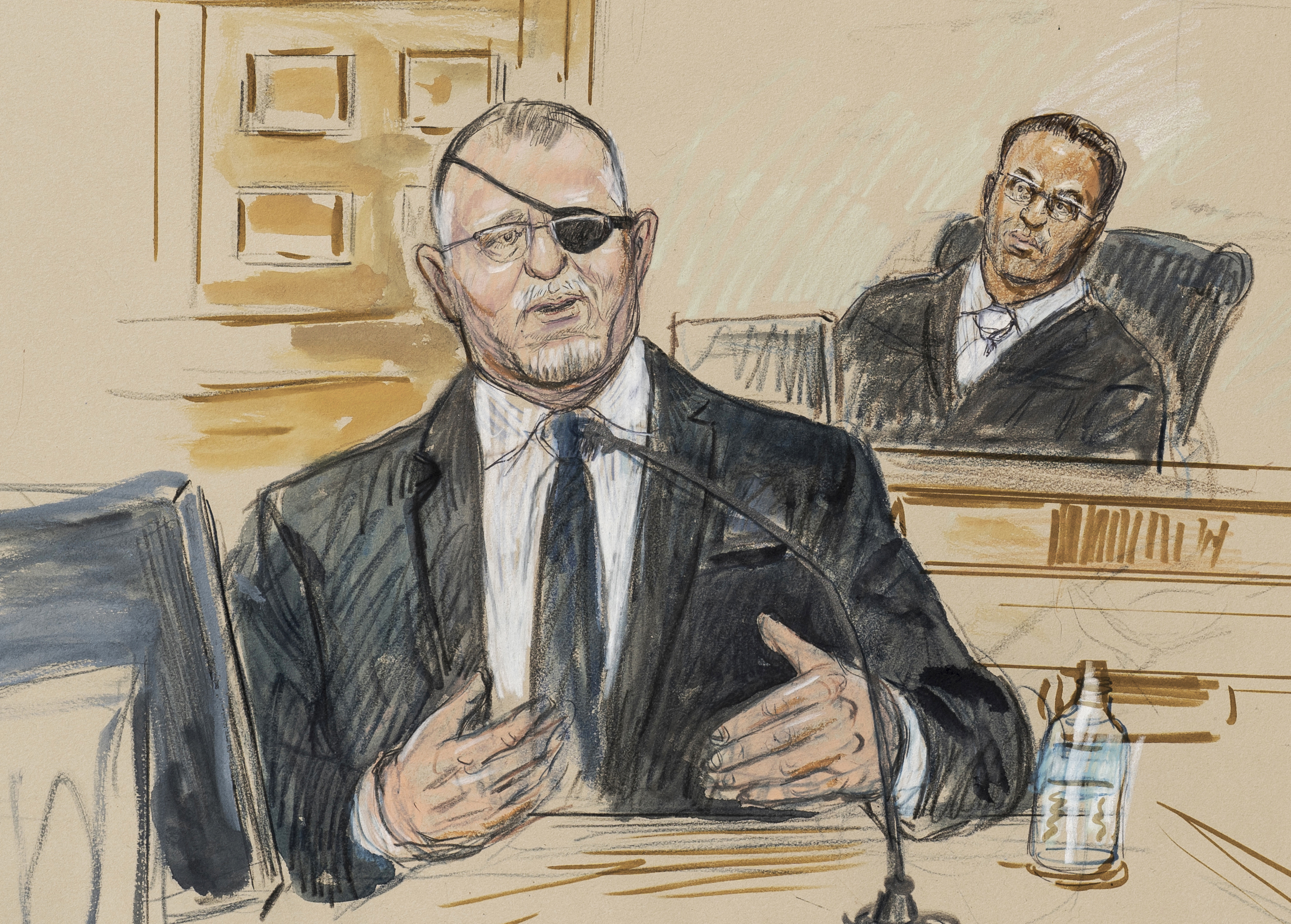 This artist sketch depicts the trial of Oath Keepers leader Stewart Rhodes, left, as he testifies on charges of seditious conspiracy in the Jan. 6, 2021, attack on the U.S. Capitol, in Washington, Nov. 7, 2022.