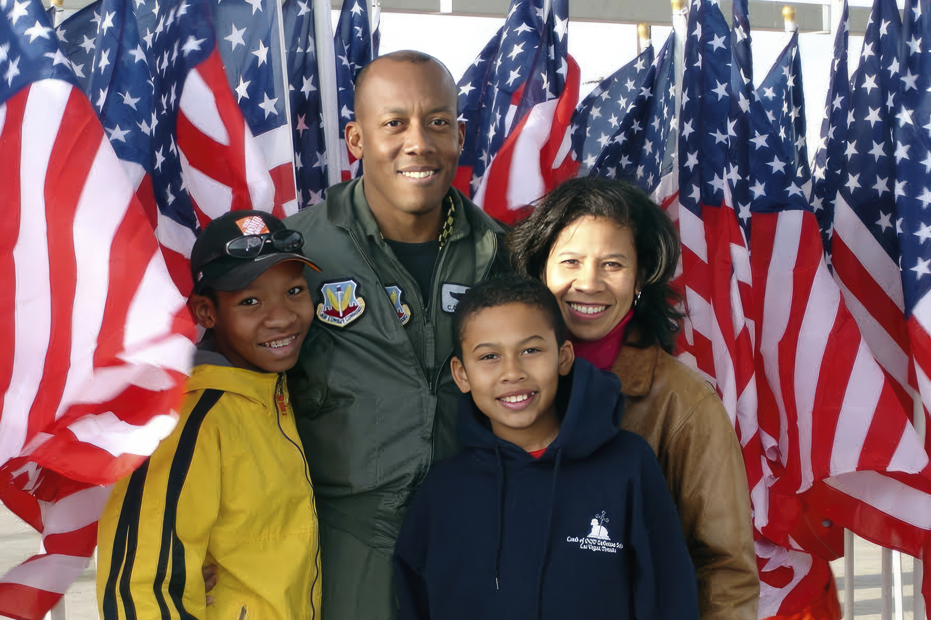 In this image provided by the U.S. Air Force, Col. CQ Brown, Jr., poses for a photo with his wife Sharene Brown, and sons, Sean and Ross, at the Nellis Air Force Base Air Show, in Nevada in 2006. Brown served as Weapons School Commandant from July 2005 to May 2007 at Nellis Air Force Base, Nevada.