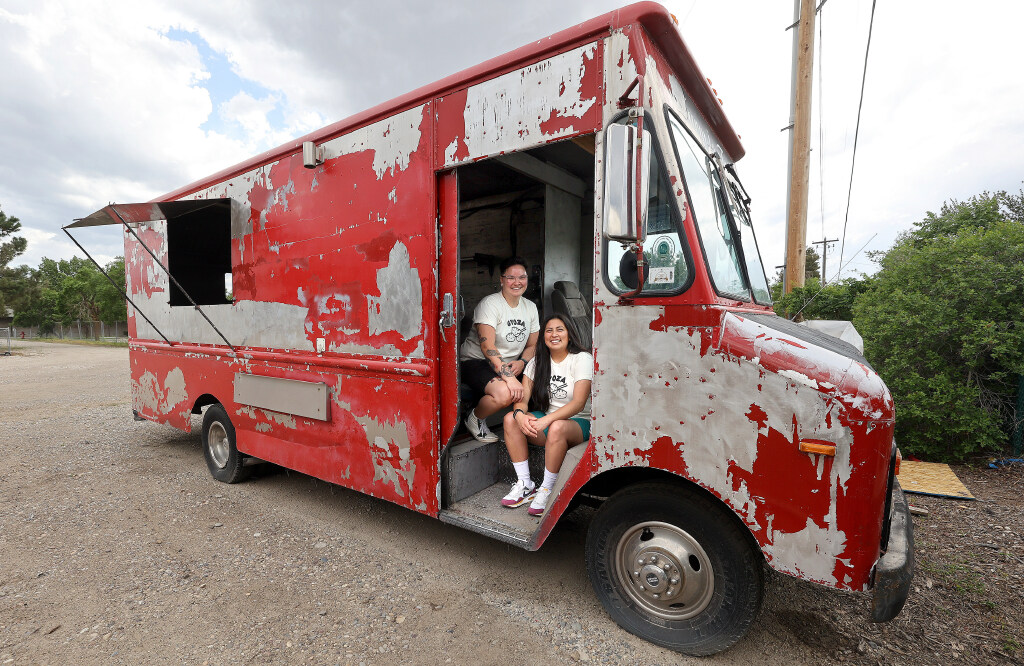 Ellie and Erika Yagi, co-owners of Yagi's Dump Truck, pose for a portrait in their work-in-progress food truck, where they will sell dumplings, in Murray on Wednesday.