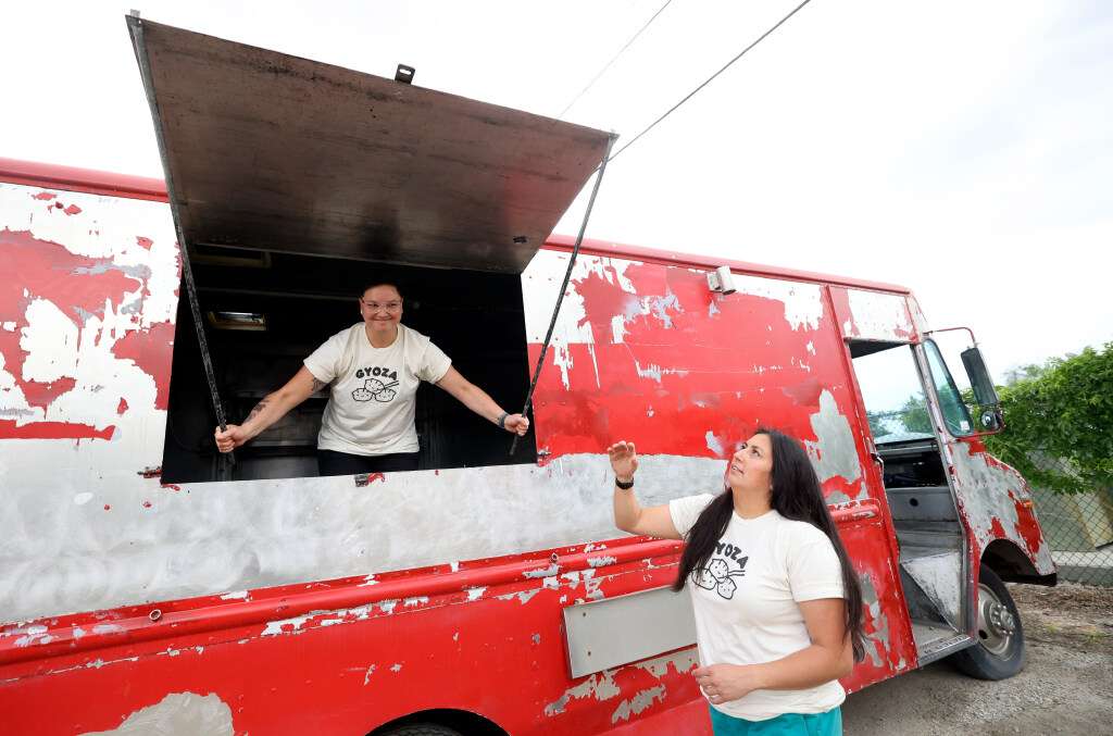 Yagi's dump truck co-owners Erie and Erika Yagi on Wednesday closed the windows of a working food truck to sell dumplings in Murray.