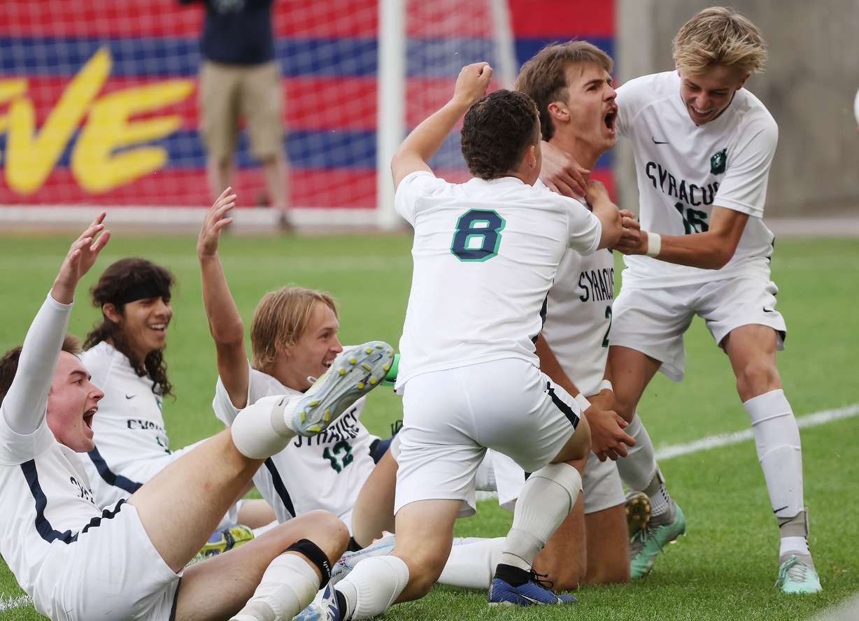 Syracuse’s Ryker Smith (2) celebrates his goal with teammates in the 6A soccer championship game in Sandy on Thursday, May 25, 2023. Syracuse won 2-0.