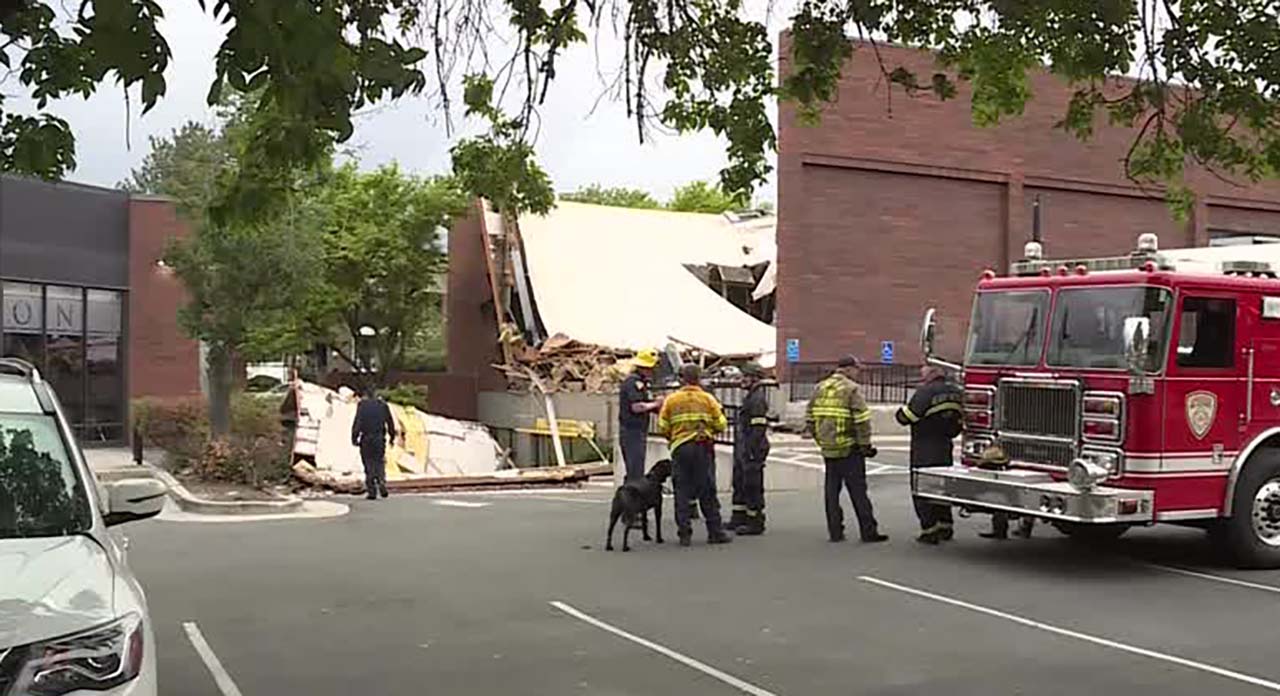Fire crews are pictured at the scene of a building that partially collapsed near 4890 S. Highland Drive Thursday afternoon.