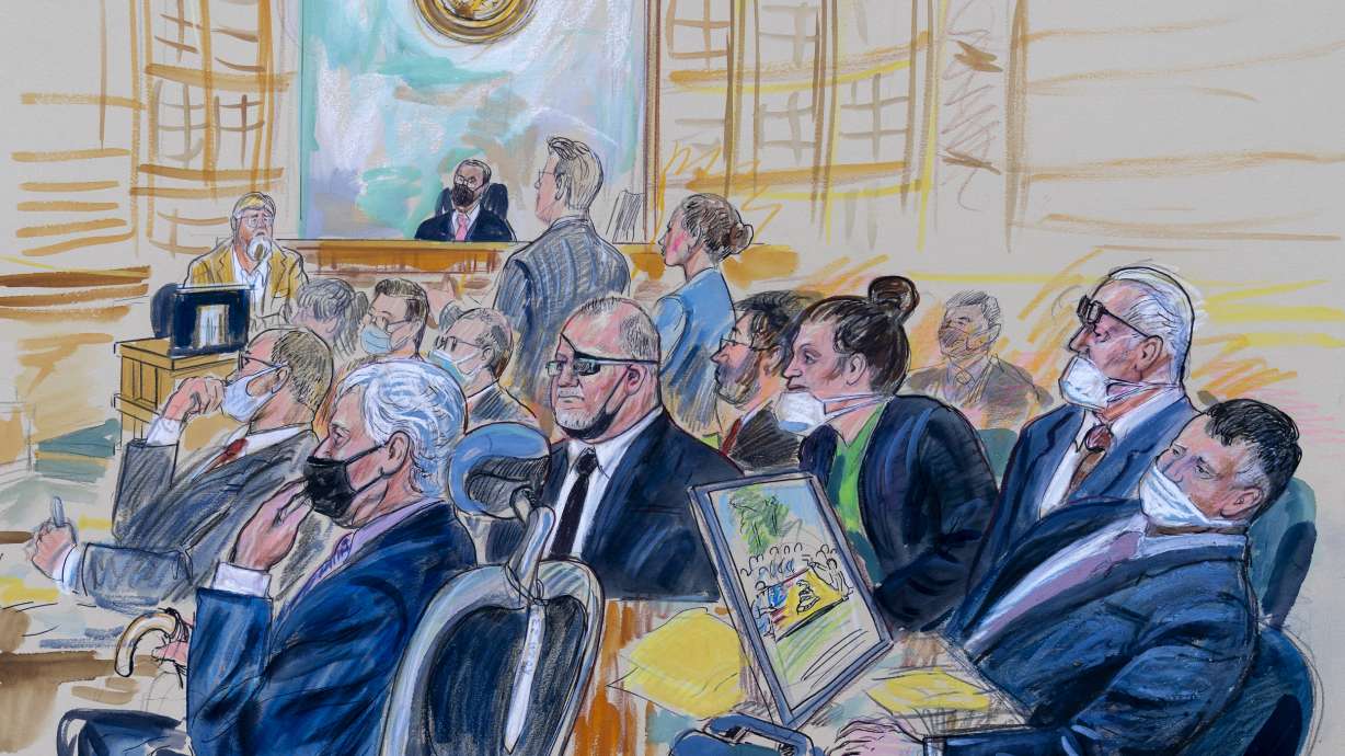 This artist sketch depicts the trial of Oath Keepers leader Stewart Rhodes and four others charged with seditious conspiracy in the Jan. 6, 2021, Capitol attack, in Washington, Oct. 6, 2022. U.S. Army veterans Jessica Watkins and Kenneth Harrelson were sentenced Friday.