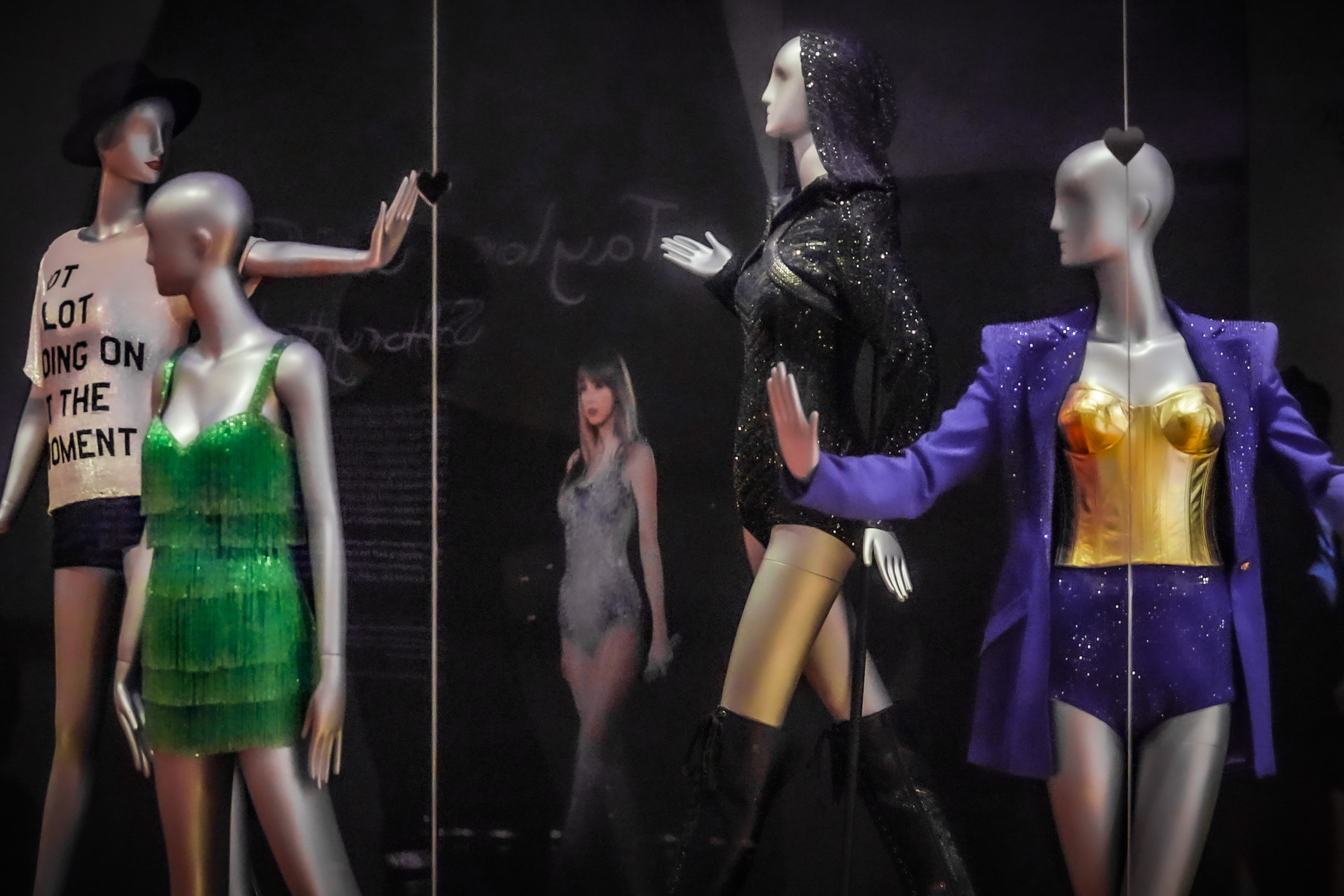 Costumes worn by singer Taylor Swift, part of the exhibition, "Taylor Swift: Storyteller," are displayed at the Museum of Arts and Design in New York on Tuesday. The exhibit runs through Sept. 4.