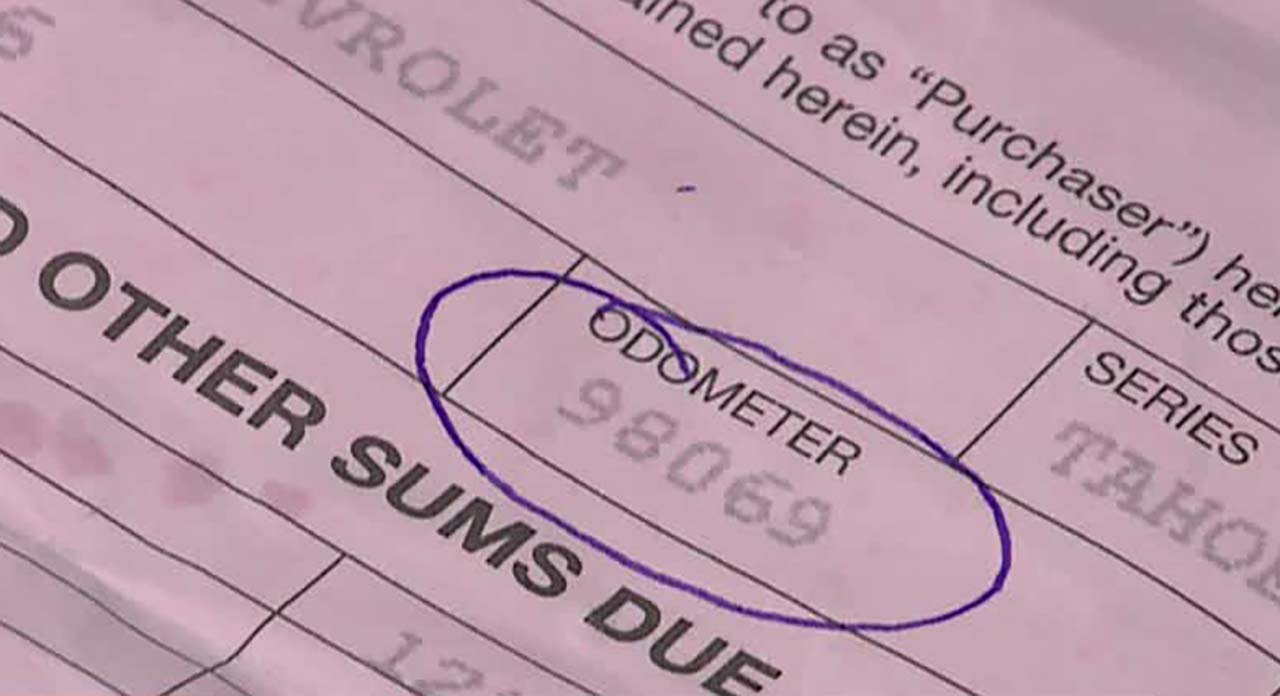 Paperwork shows Wendie Muhic's 2007 Chevy Tahoe with 98069 miles.
