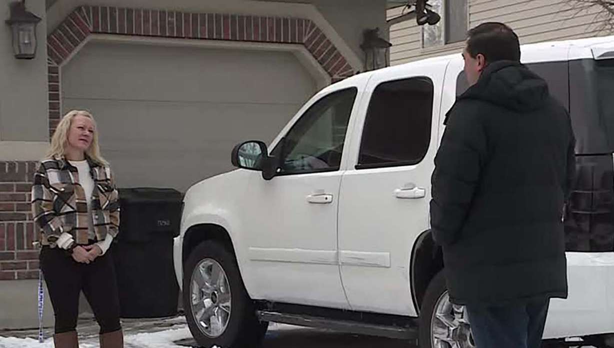 Wendie Muhic talks to KSL's Matt Gephardt next to her 2007 Chevy Tahoe. A report shows that by November 2021, the Tahoe had racked up 180,353 miles. But two months later, the odometer read a mere 97,836.