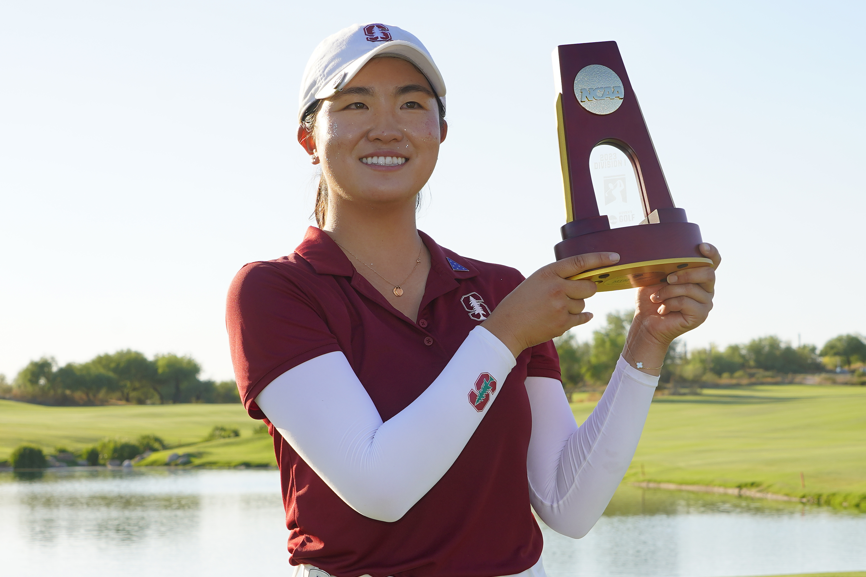 Stanford golfer Rose Zhang holds the champions trophy after the final round of the NCAA college women's golf championship at Grayhawk Golf Club, Monday, May 22, 2023, in Scottsdale, Ariz. 